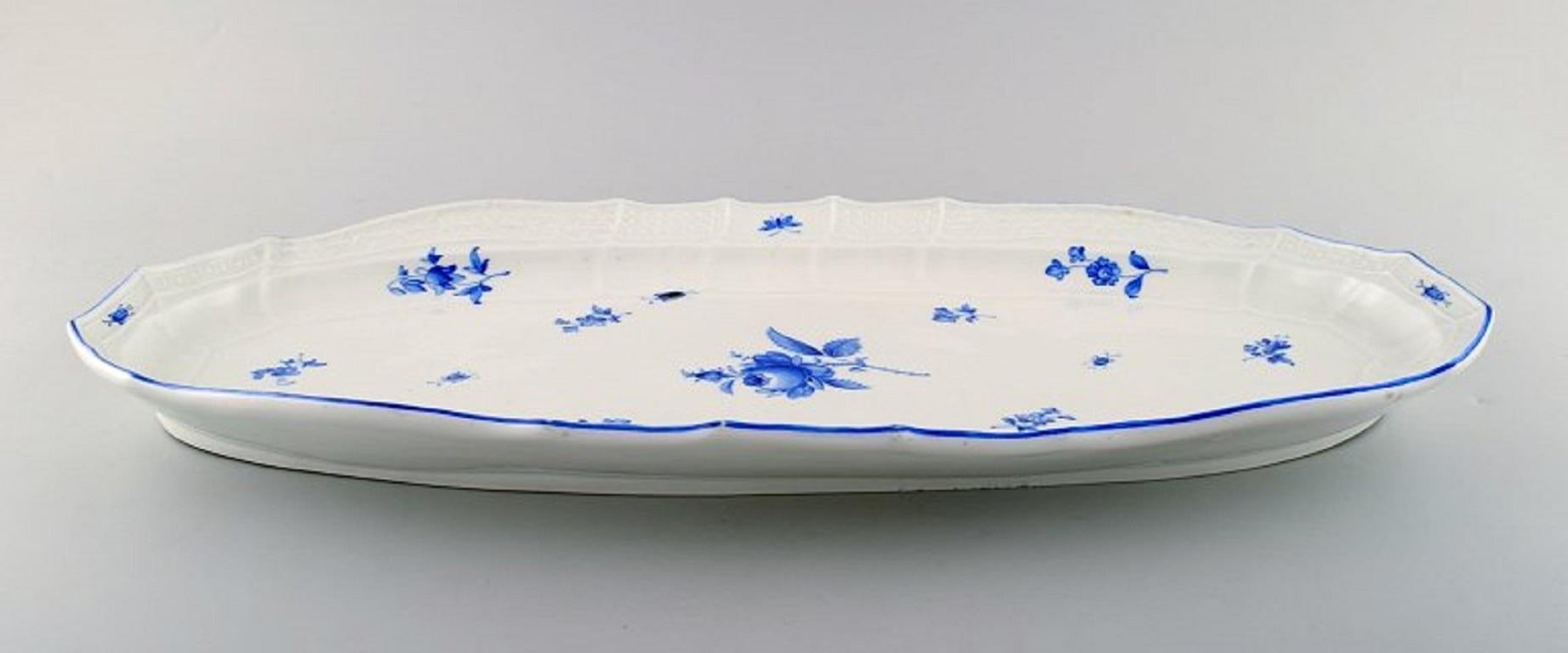 Meissen large fish dish in porcelain. Hand-painted with blue roses and beetles. 
Ca. 1900.
In very good condition. 3rd factory quality. 
Stamped.
Measures: 53 x 25 cm.