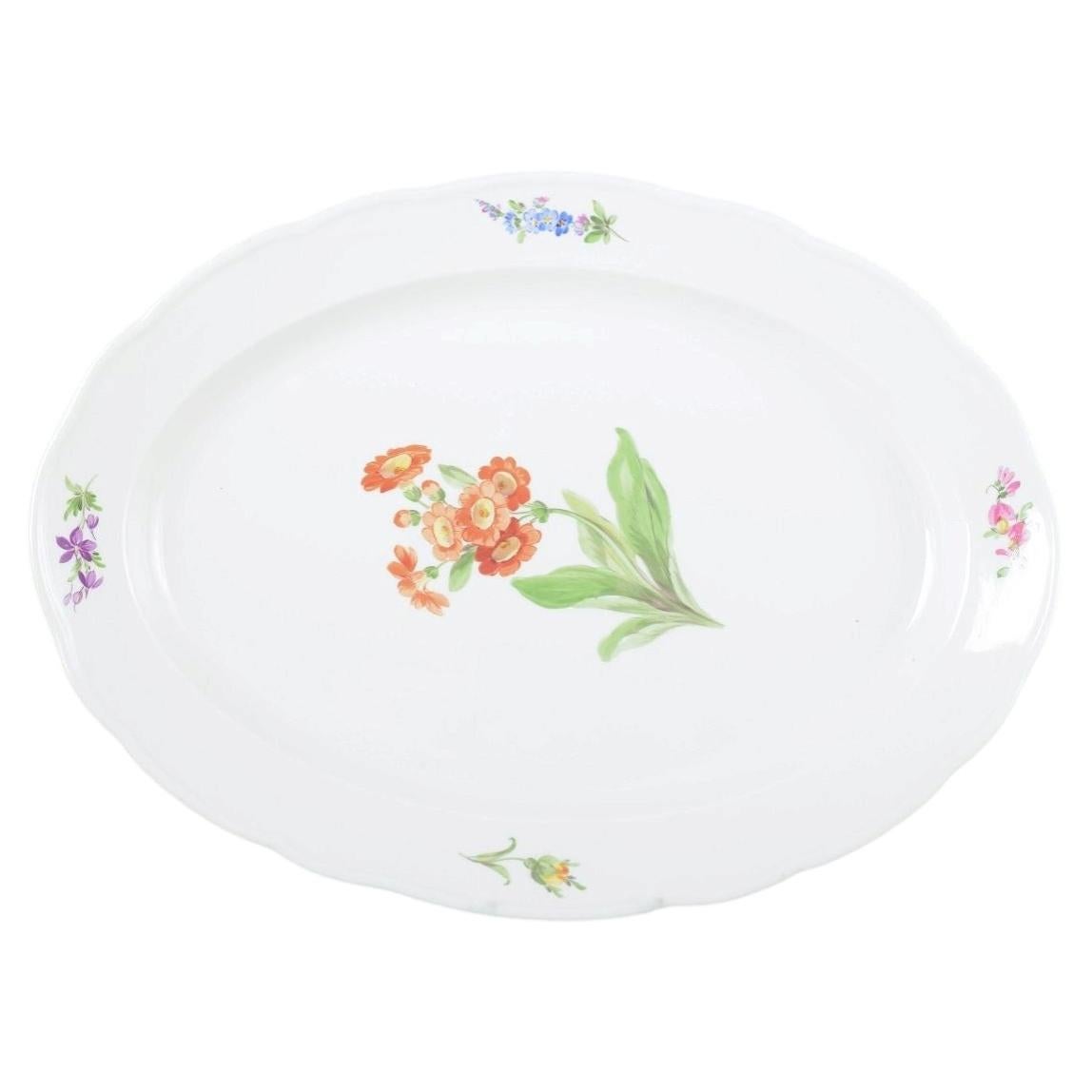 Meissen. Large oval serving dish in porcelain with floral motif. Ca 1930s
