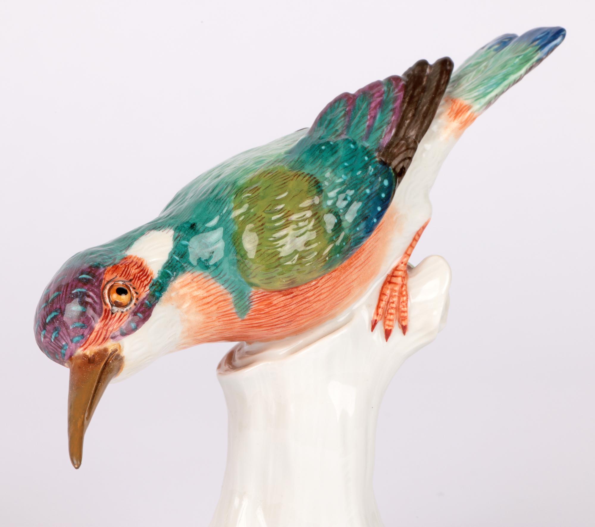 A large and stunning German porcelain figure if a Kingfisher by acclaimed porcelain makers Meissen and dating from the 20th century. The kingfisher stands raised on tree stump shaped base applied with leaves and small flower heads. The kingfisher is