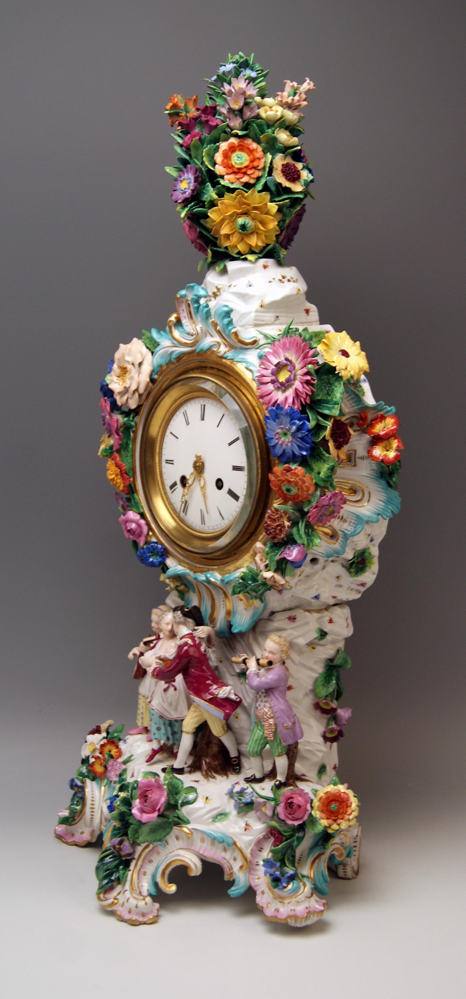 Meissen huge table clock / mantle clock / mantelpiece clock decorated with sculptured flowers and figurines, circa 1880.

Size:
Height 25.98 inches / 66.0 cm
Width 11.81 inches / 30.0 cm
Depth 8.66 inches / 22.0 cm

Manufactory: Meissen
Hallmarked: