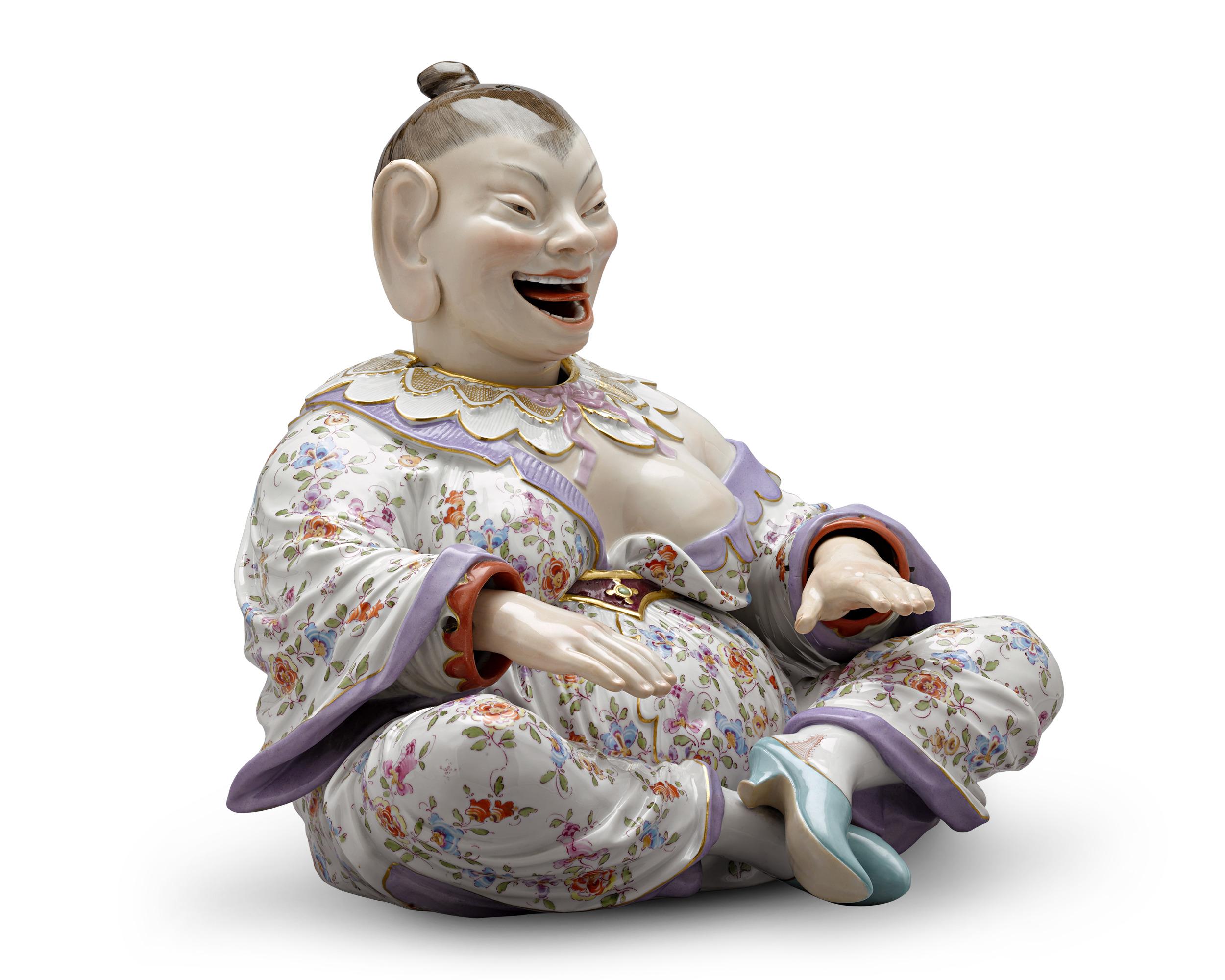 Diese bezaubernde Porzellanfigur aus dem legendären Meissen zeigt die Form einer asiatischen Frau in farbenprächtigen Gewändern. Das perfekt ausbalancierte Design enthält versteckte Federn im Inneren, die die Figur bei der kleinsten Erschütterung in