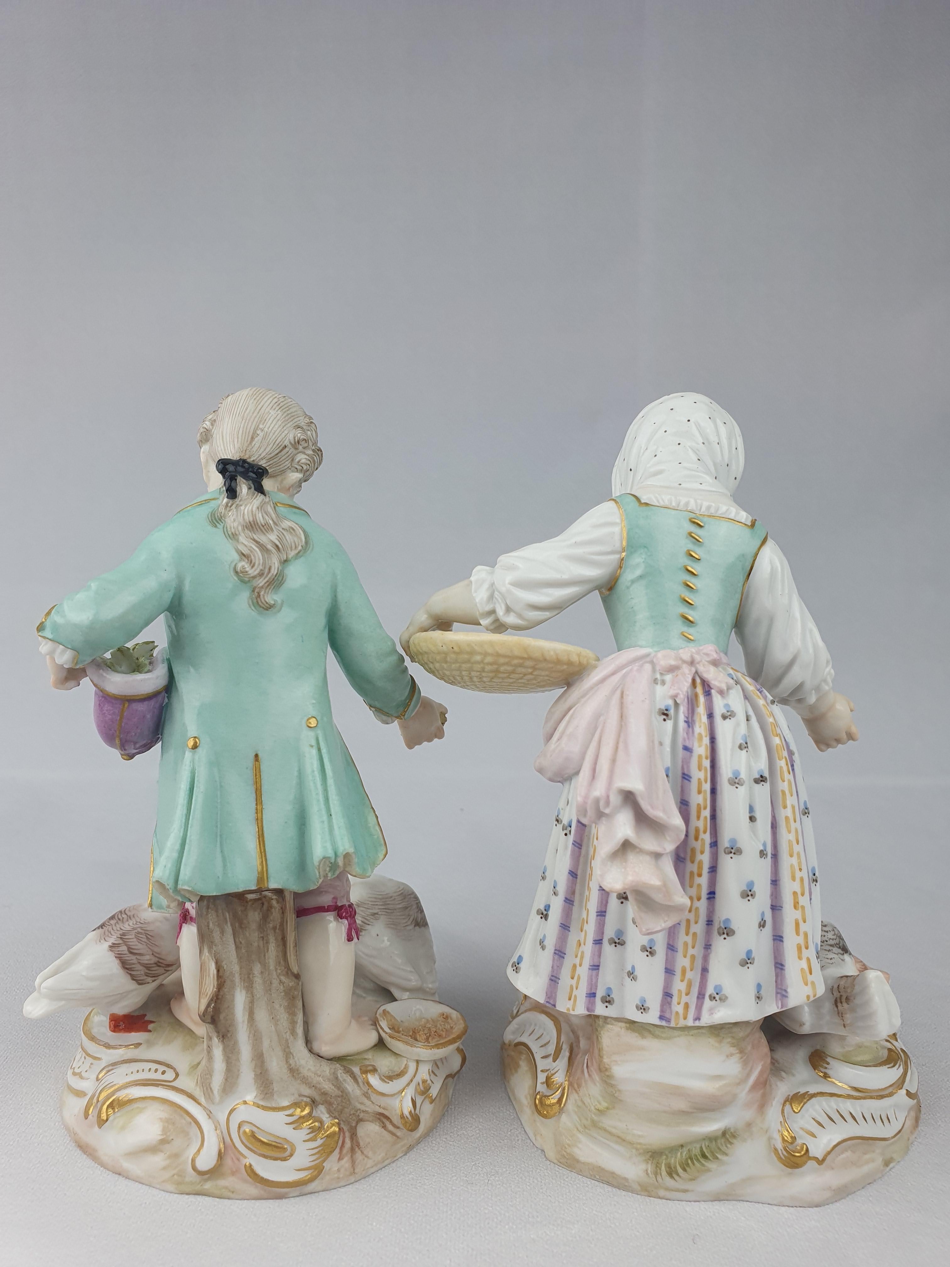 Pair of Meissen Figures circa 1870. The girl feeding chickens, the boy feeding geese. The pair first modelled by J.J Kaendler in 1761. Both figures in complementing colours of teal and pink. Painted detail on both figures is of high quality.

Both