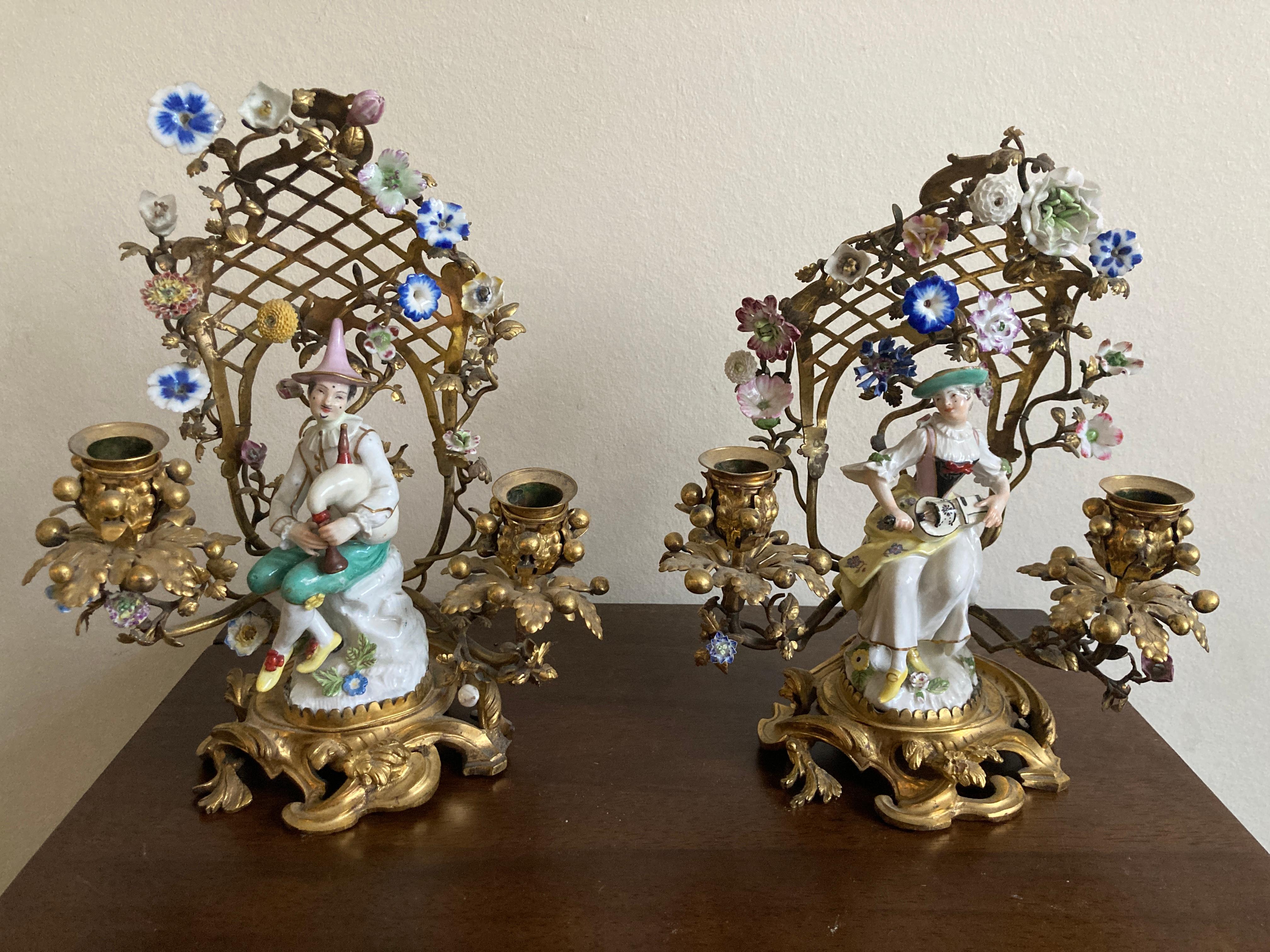 Meissen Porcelain Figurines, Pair of seated Musician figures. 14cm high figures, 

Crossed swords mark to rear of base, c1745.

Both figures mounted in an 18th Century ormolu arbour set, 25cm overall height


