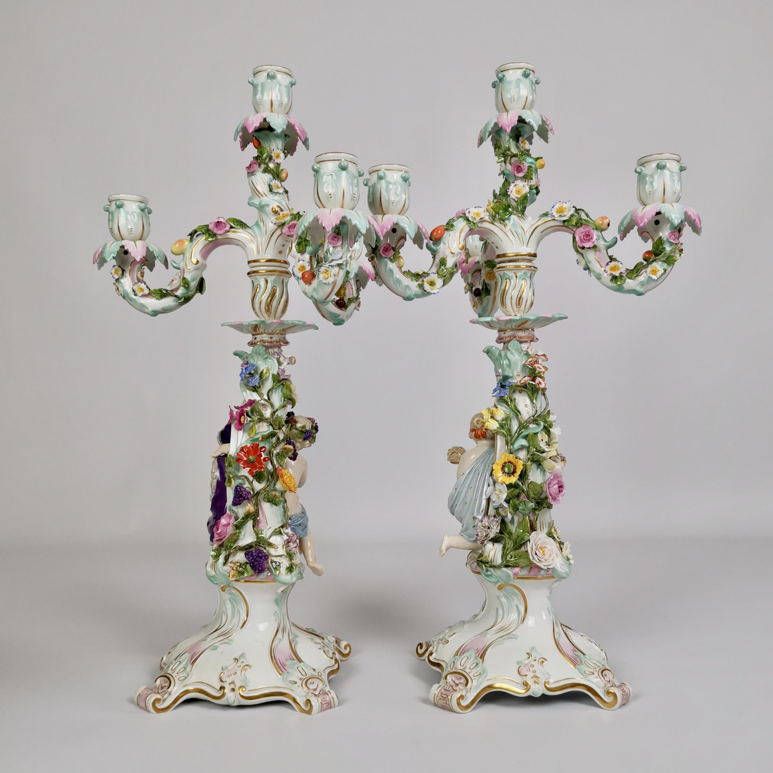 This is a spectacular pair of four-sconce candelabra made by Meissen in the last quarter of the 19th Century. The top parts of the candelabra are loose so they can be cleaned separately. The stems are decorated with beautifully shaped putti figures