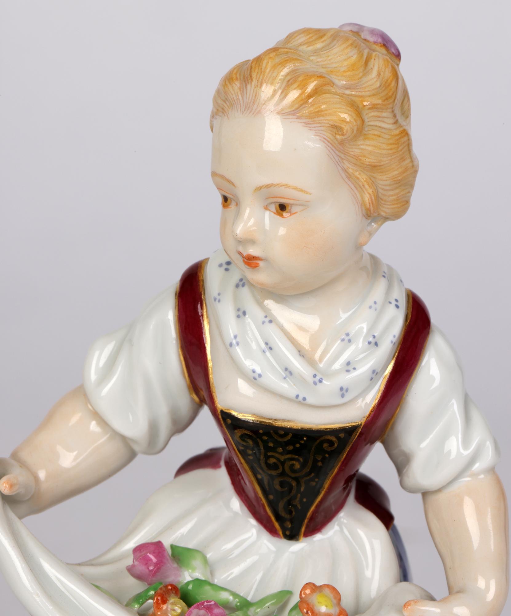 A fine quality pair antique Meissen porcelain figures of children with flowers dating from the latter 19th or early 20th century. Both figures stand raised on a scroll work rounded base decorated with gilded and floral designs and comprise of a you