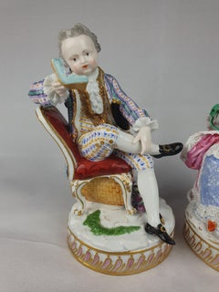 Meissen Pair Seated Man Reading and Woman with Yarn Winder