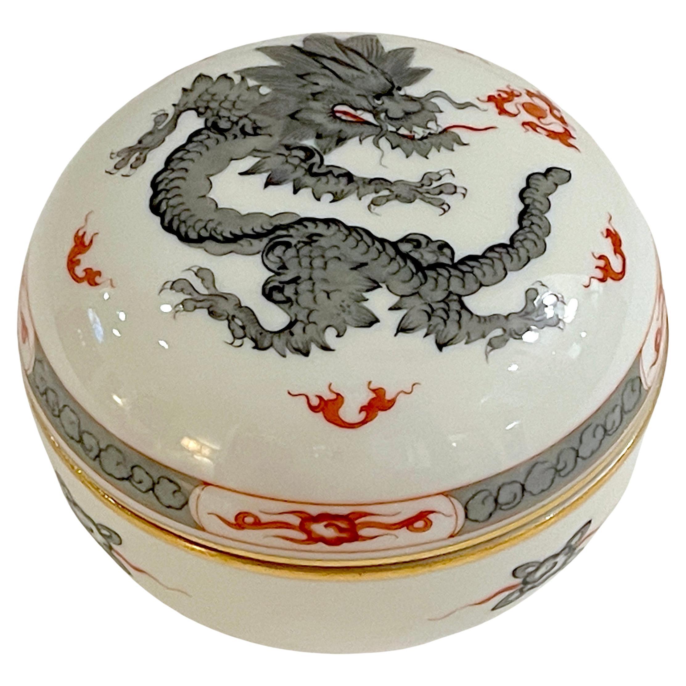 Meissen Porcelain Black  'Ming Dragon' Covered Box 
Germany, Post WWII 20th Century, Two Slash Canceled Blue Crossed Swords Mark

A fine Meissen Porcelain Black 'Ming Dragon' Covered Box, made in post-World War II Germany during the 20th century.