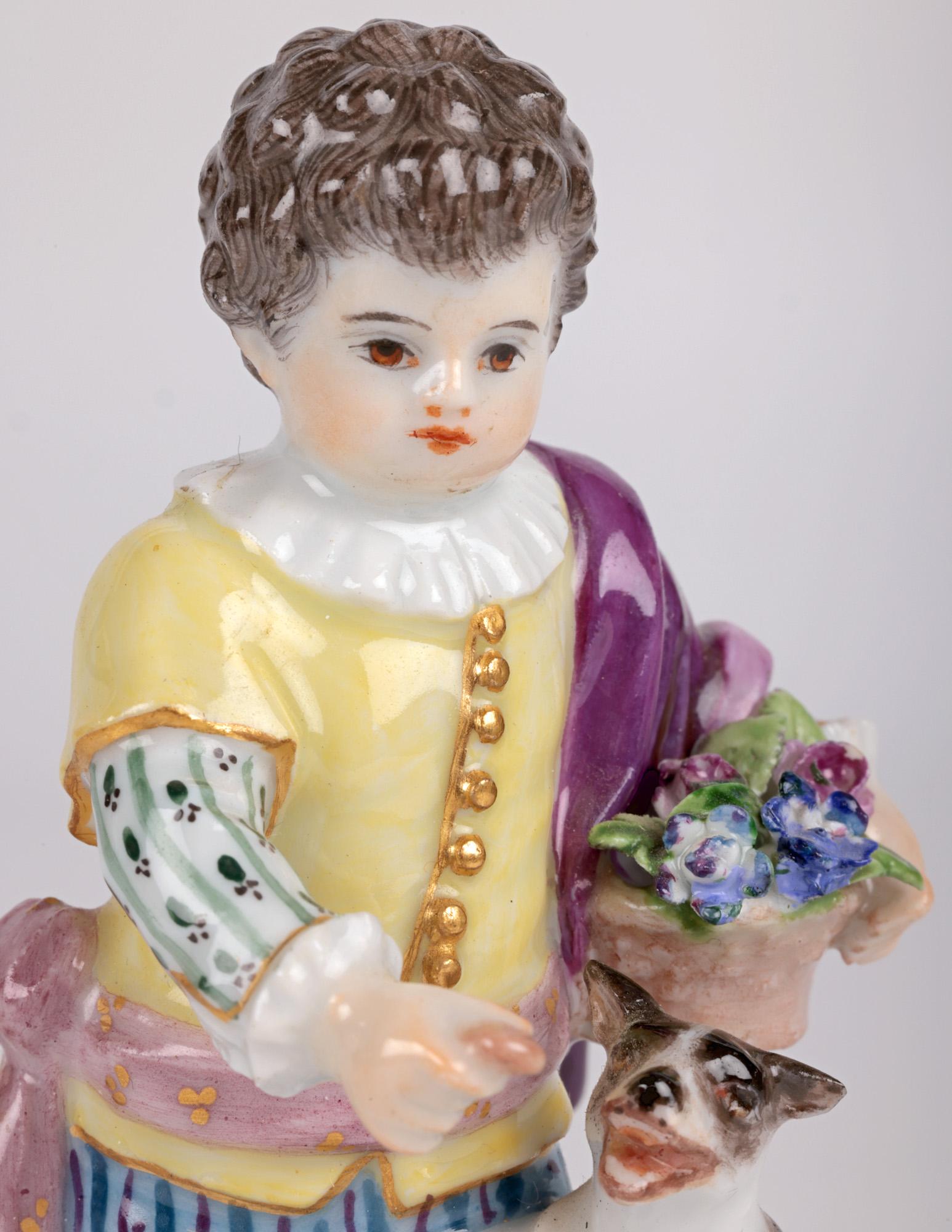 A fine antique German porcelain figure of a boy with a dog by world renowned makers Meissen and dating from the 19th century. The figure of a young boy in typical period dress stands mounted on a small square pedestal base and holds a basket of