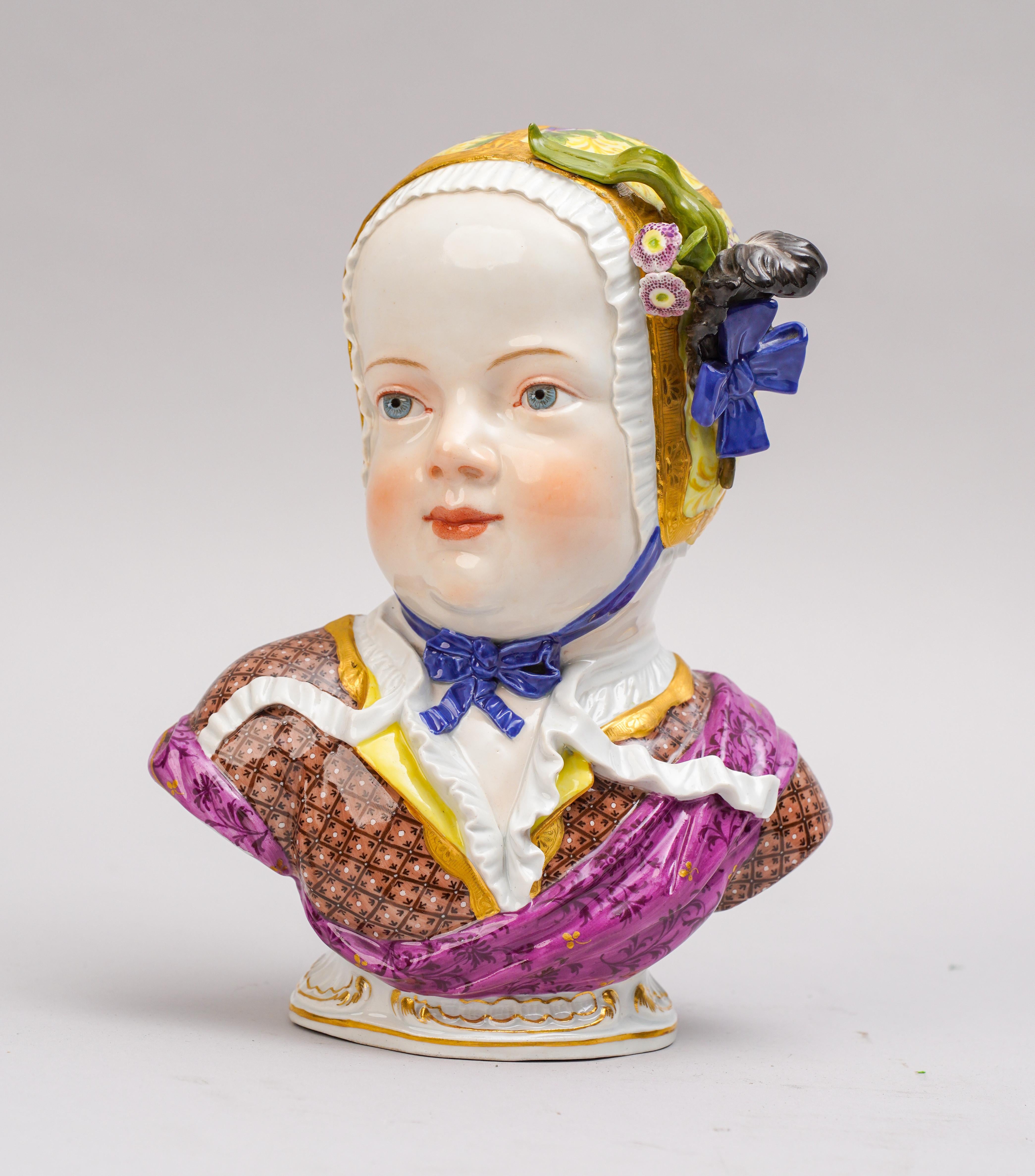 Large Meissen Porcelain modeled as a bust of a young child wearing a floral decorated cap, wearing open shirt with floral embellished sash.

Late 19th century

Crossed swords in underglaze blue.

Measures: Height: 9