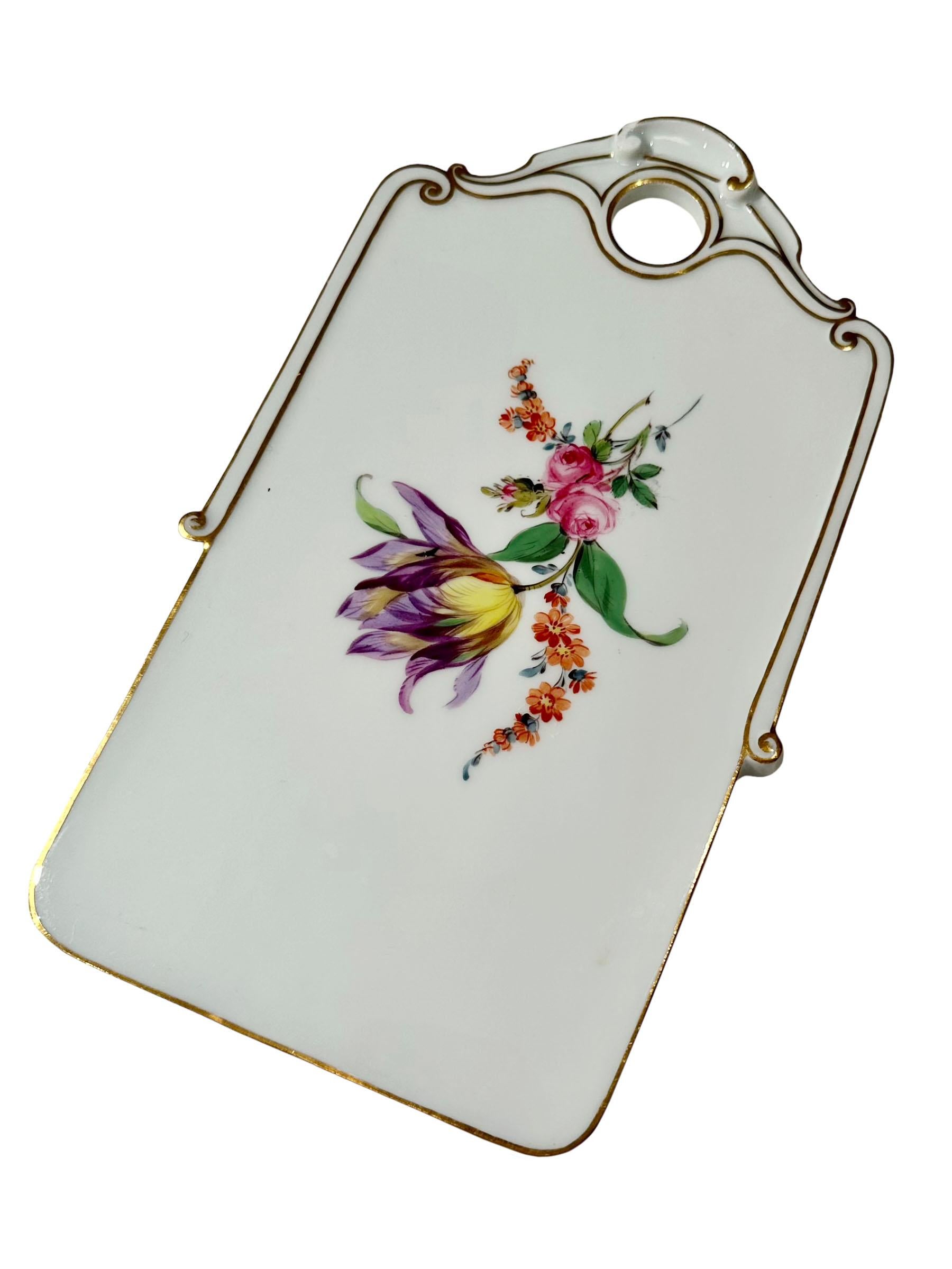 A vintage 1940s Meissen plaque with a flower bouquet on the front and Meissen mark on the reverse. 
