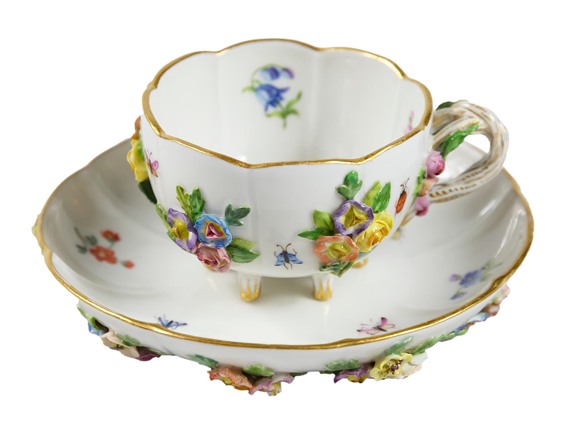 Meissen Porcelain coffee cup with saucer hand painted with insects and decorated with embossed flowers.
Measures:
Cup 5 (H) x 10.5 x 8 cm
Saucer 3 (H) x 14 cm.
 
  