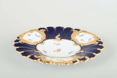 Meissen. Porcelain dish with scalloped edges, cobalt blue glaze, floral pattern.