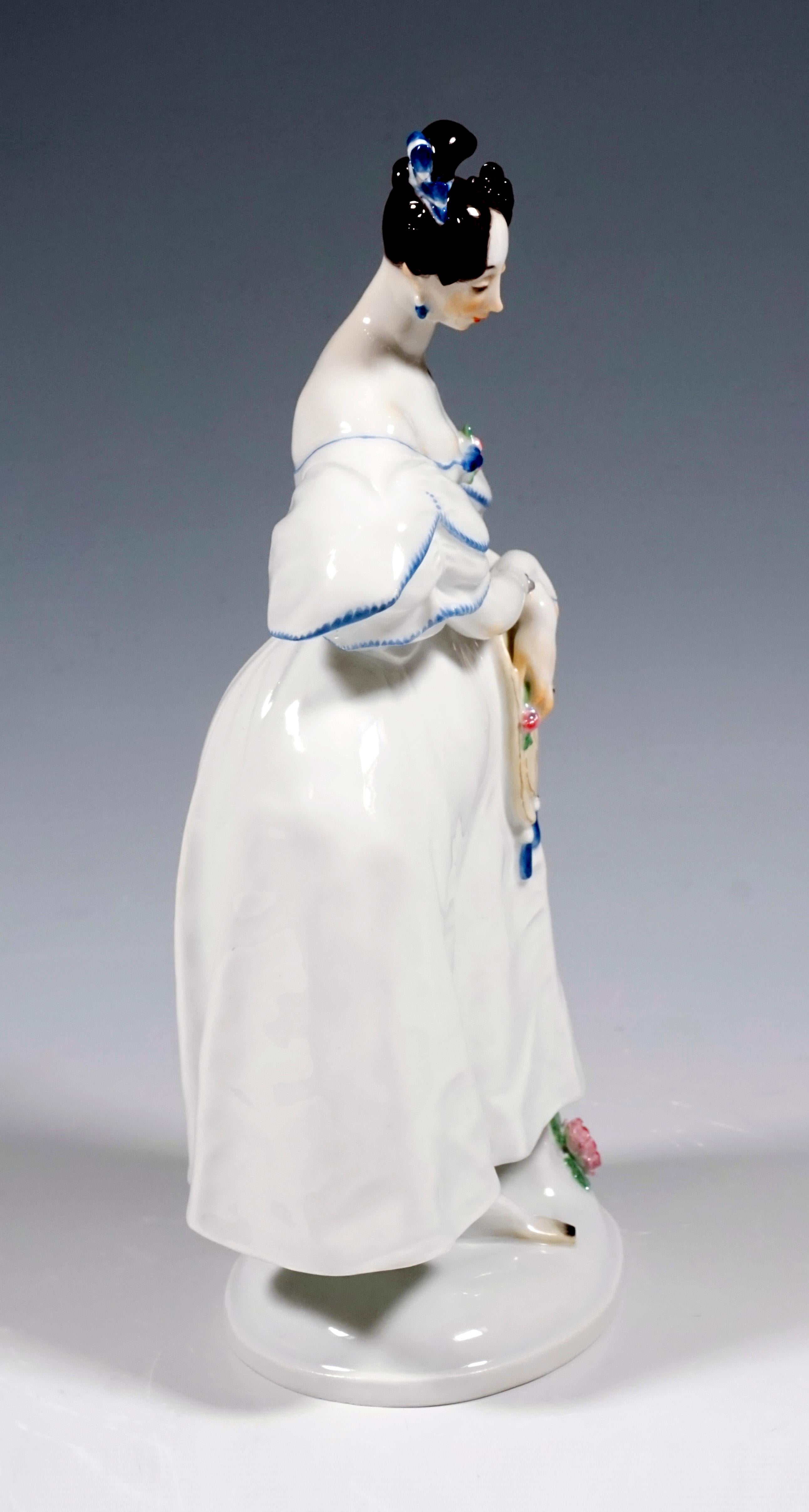 Standing female figure with artfully pinned dark brown curls and a white Biedermeier dress leaning against a pedestal. The young lady with bowed head and modest look is the opposite of the vain 'dude' (model number F 235).
On an oval, white, domed