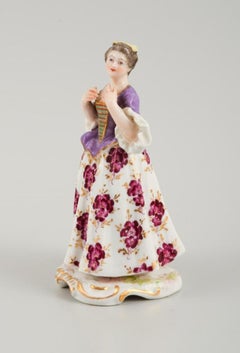Meissen, porcelain figurine of a lady in fine dress. Late 19th century