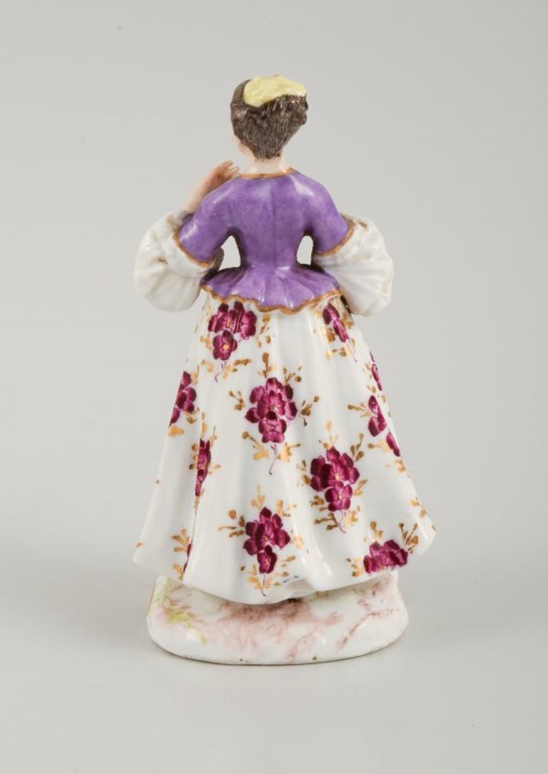 Rococo Revival Meissen, porcelain figurine of a lady in fine dress. Late 19th century