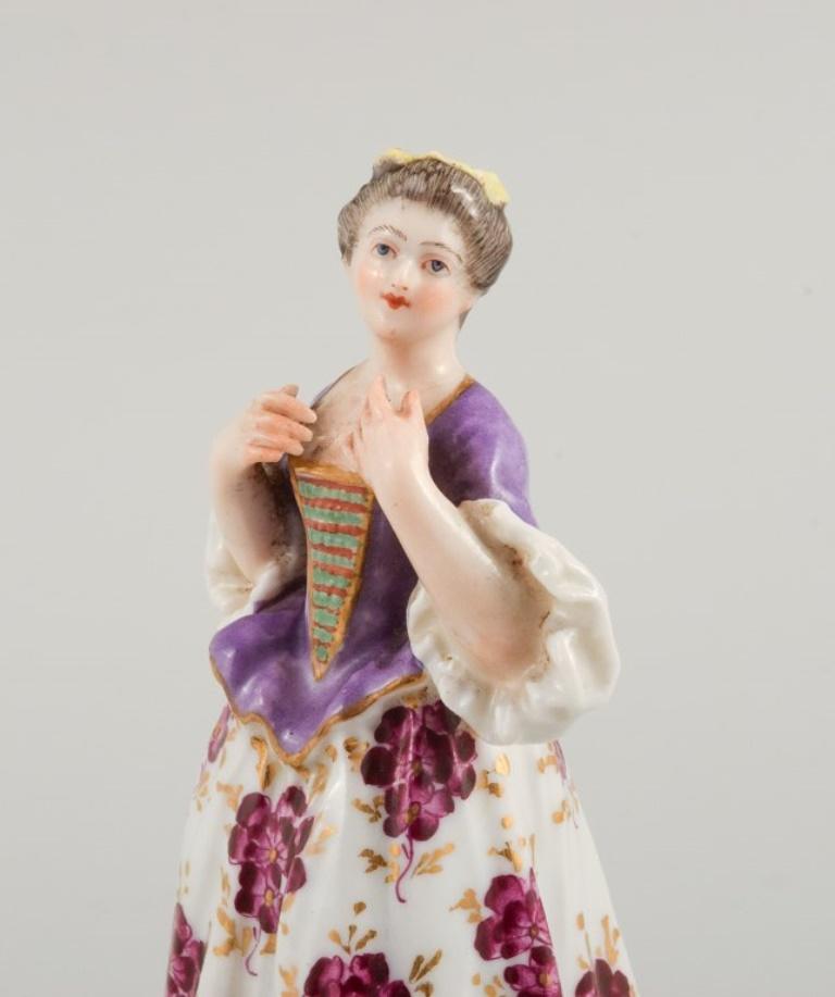 German Meissen, porcelain figurine of a lady in fine dress. Late 19th century