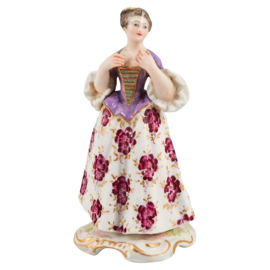 Meissen, porcelain figurine of a lady in fine dress. Late 19th century