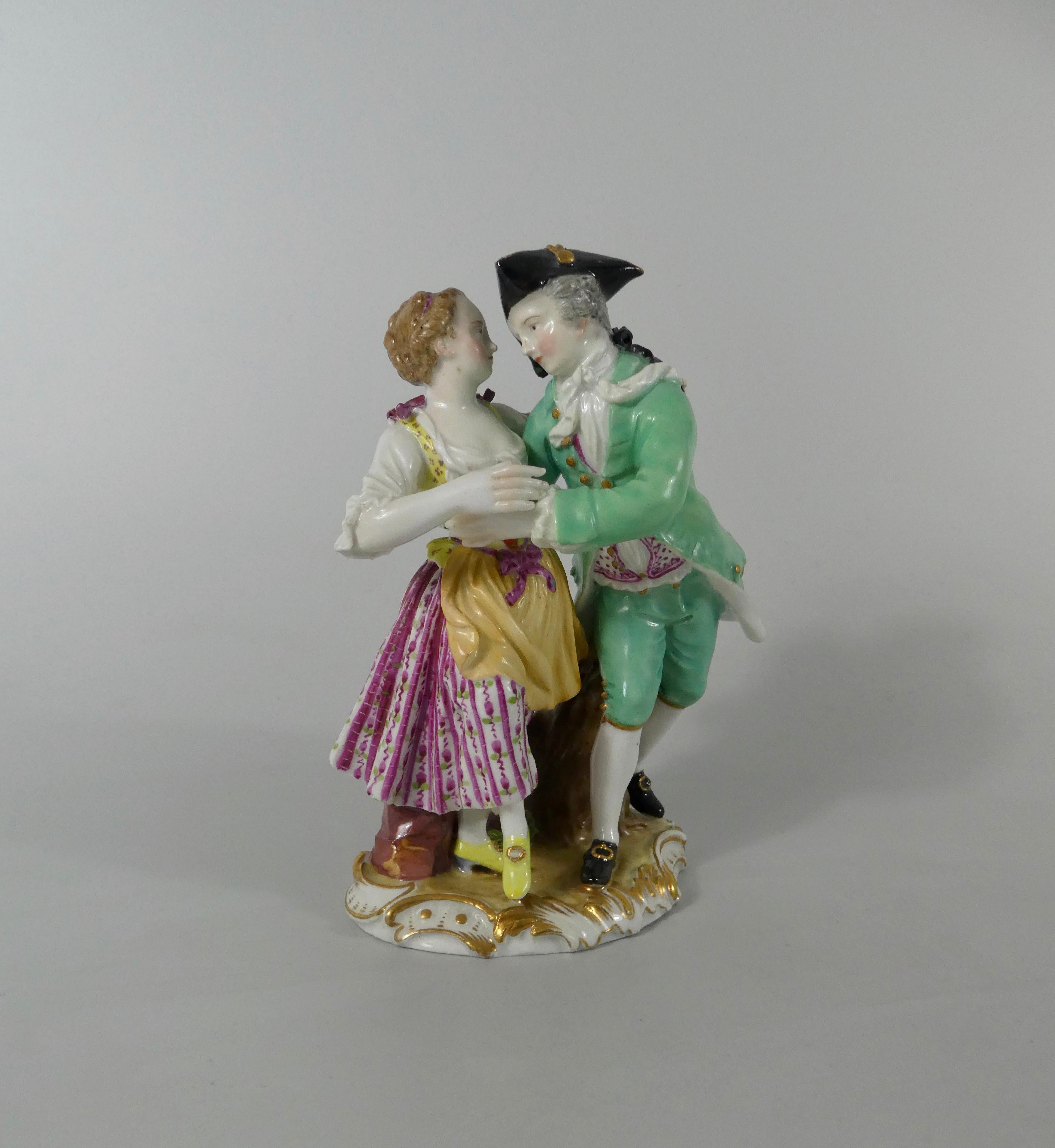 Meissen porcelain group of dancers, circa 1770. Finely modelled as an elegant 18th century couple dancing. Set upon an oval base, moulded and gilded with Rococo scroll.
Crossed swords in underglaze blue, to the base.
Measures: Height 15.5 cm, 6