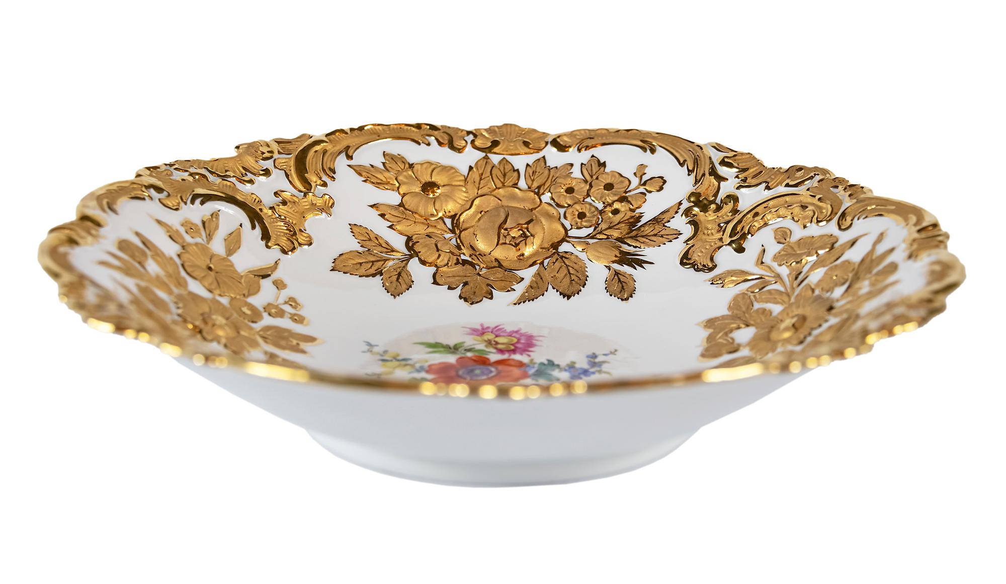 Meissen Porcelain deep plate with hand painted relief floral motives and rich gold decor.
  