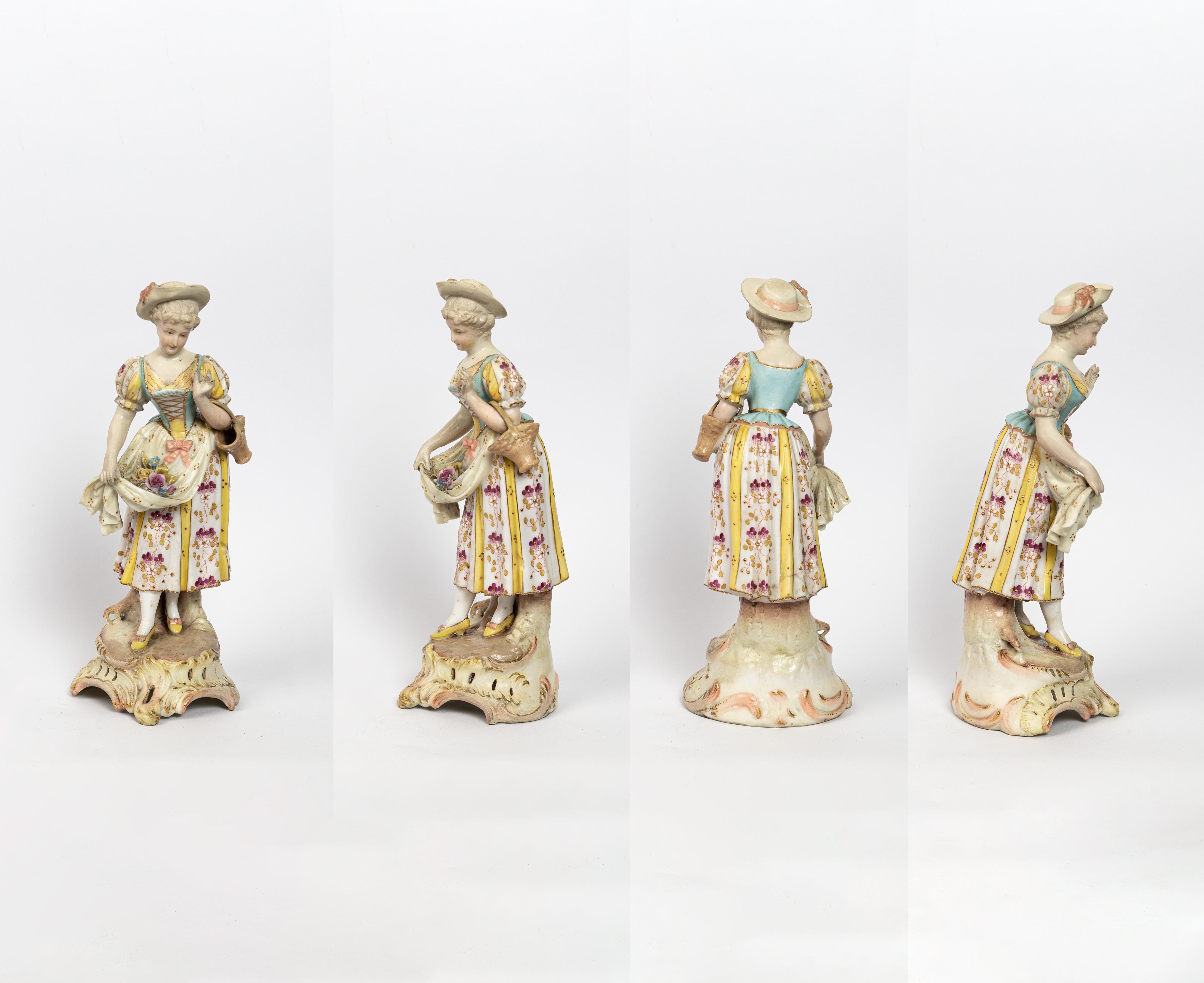 A pair of 19th-century Meissen porcelain figurines in Rococo Revival style, depicting a romantic couple in floral costumes.

These finely detailed polychrome porcelain figures capture the elegance and charm of 18th-century courtship scenes,
