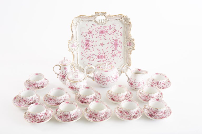 Beautiful German Meissen porcelain coffee / tea service for twelve people. The coffee / tea service is in great condition. Just exquisite & very rare to find a complete service for twelve. Each piece has a detailed painting of pink flowers with some
