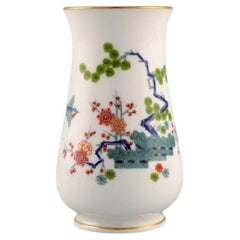 Antique Meissen porcelain vase with hand-painted branches, flowers and birds. Japanism