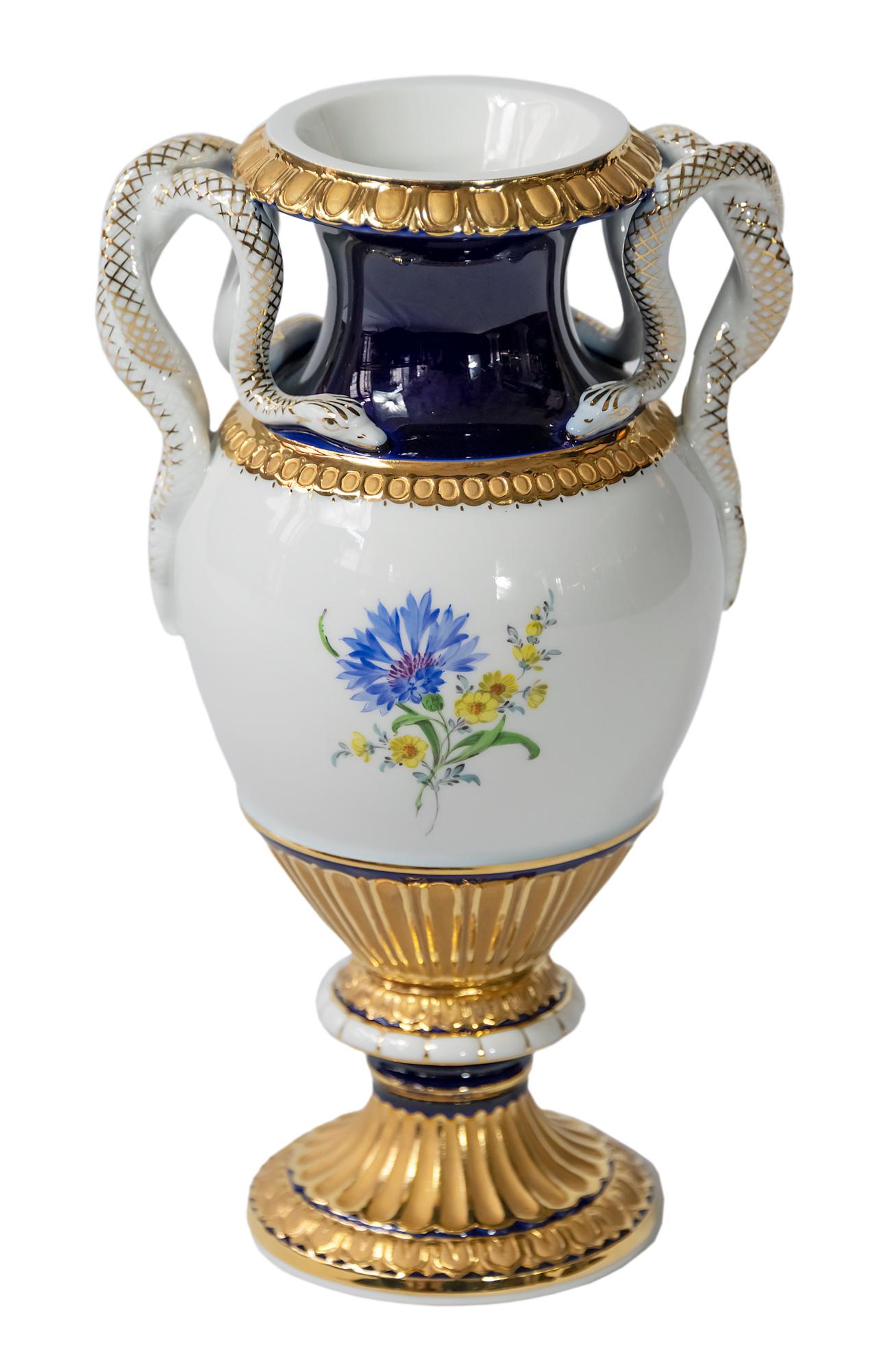 Meissen porcelain vase in cobalt blue and rich gold.
Decorated with hand painted flowers and snake handles.
1st choice.