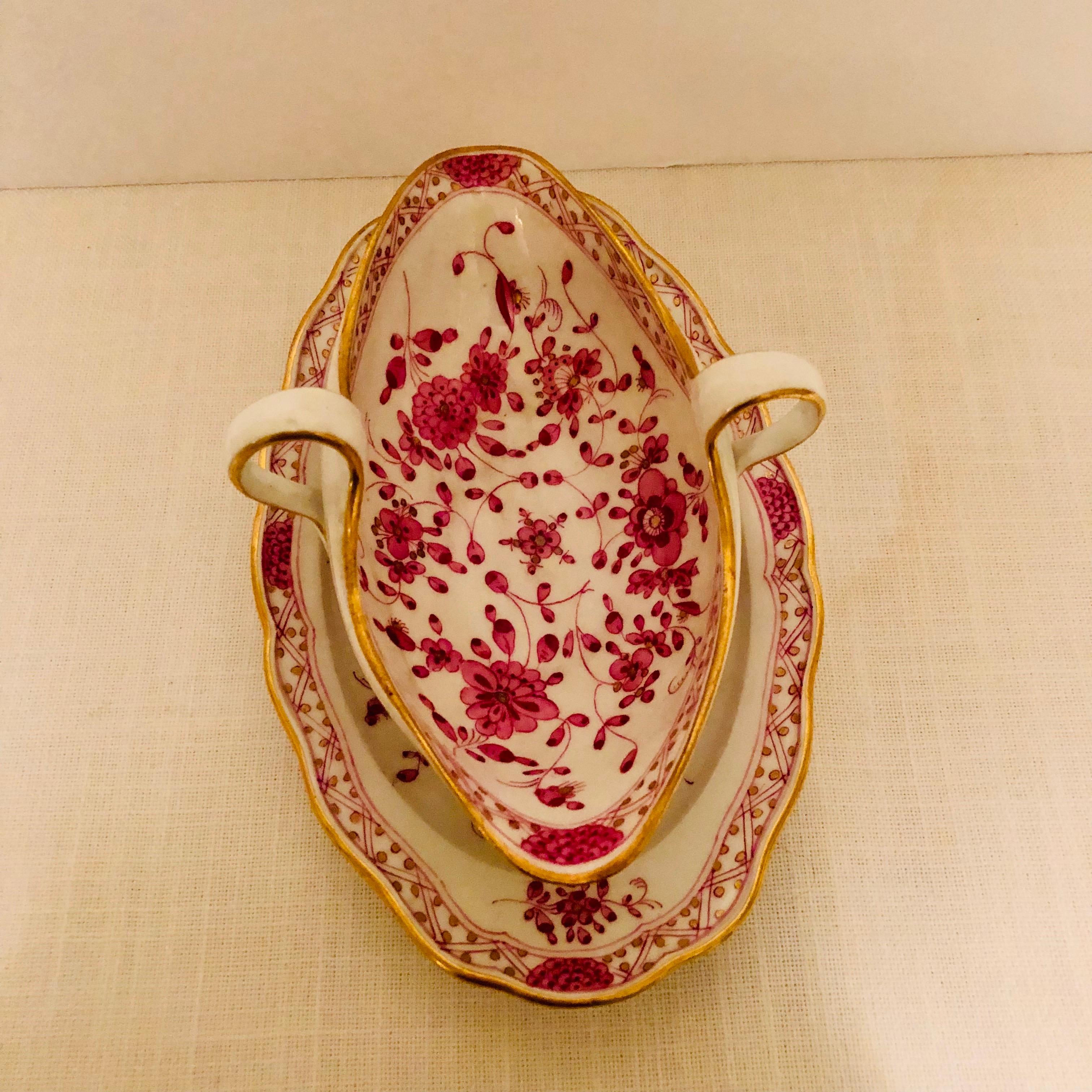 We are offering you this fabulous Meissen purple Indian gravy with an attached underplate. This gravy dates back to the 1890s. It has detailed paintings of pink flowers with some purple and gold accents on a white ground. The detail of the painting