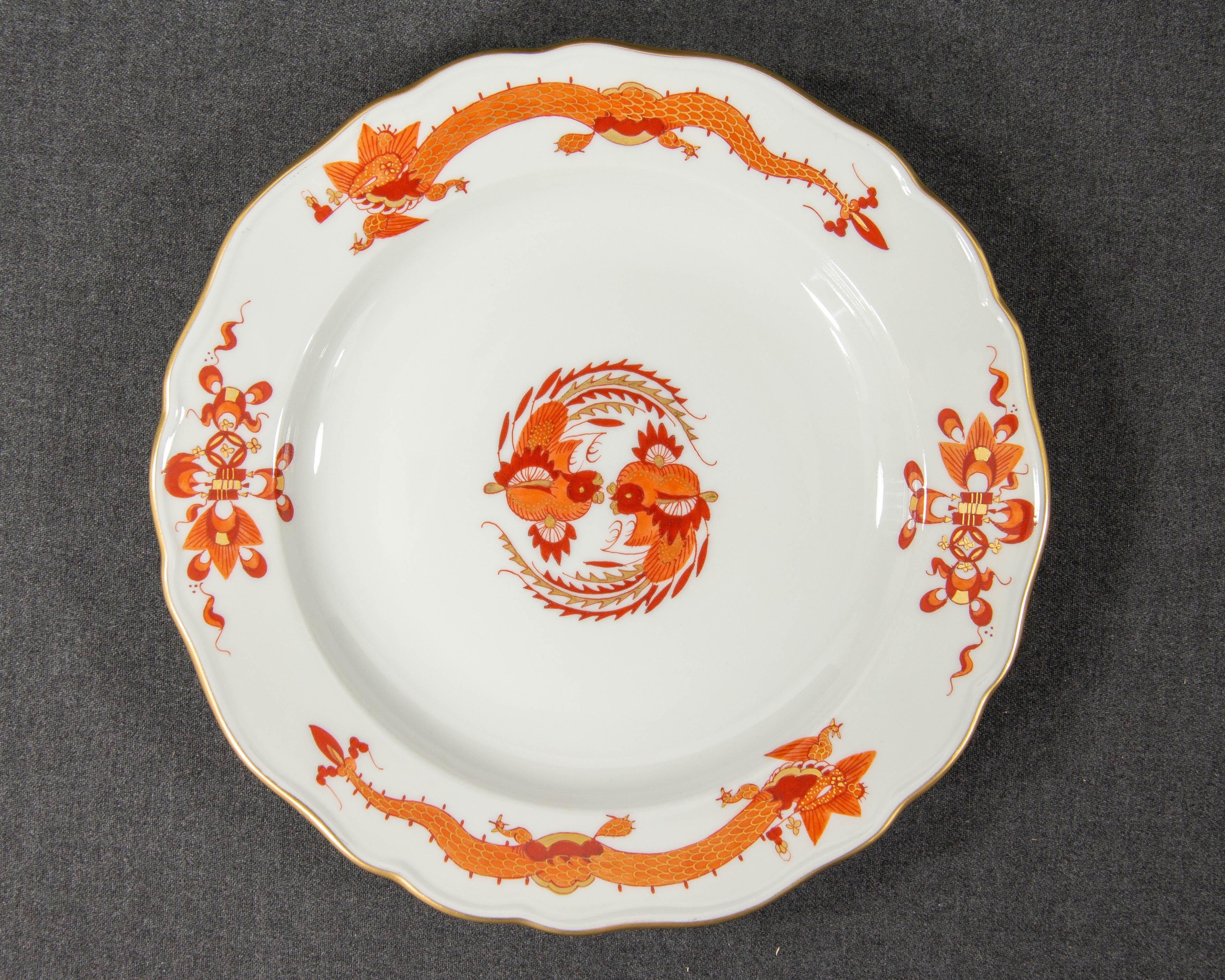 A Meissen Red Dragon Breakfast plate.

The plate was made by Meissen and has been decorated with the 'Court Dragon' pattern in red. The item was made in the 2nd half of the 20th century.

The item is made of white porcelain and is hand painted