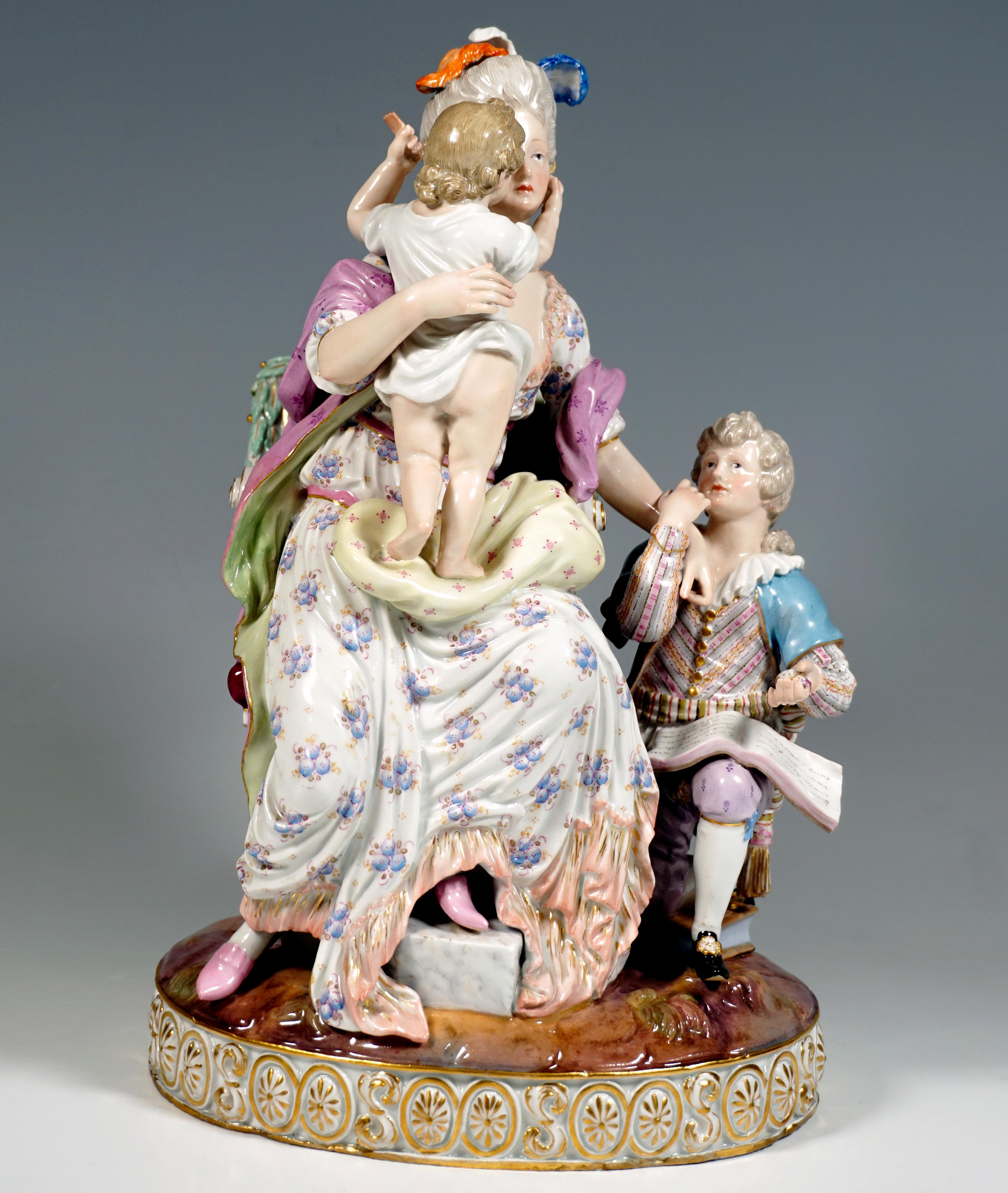 Elaborate porcelain group of the 19th century:
Young mother in elaborate Rococo clothing, seated on a magnificent Louis XVI-style armchair, resting her left foot on a low pedestal, on her lap the younger child, a boy in a white shirt, standing