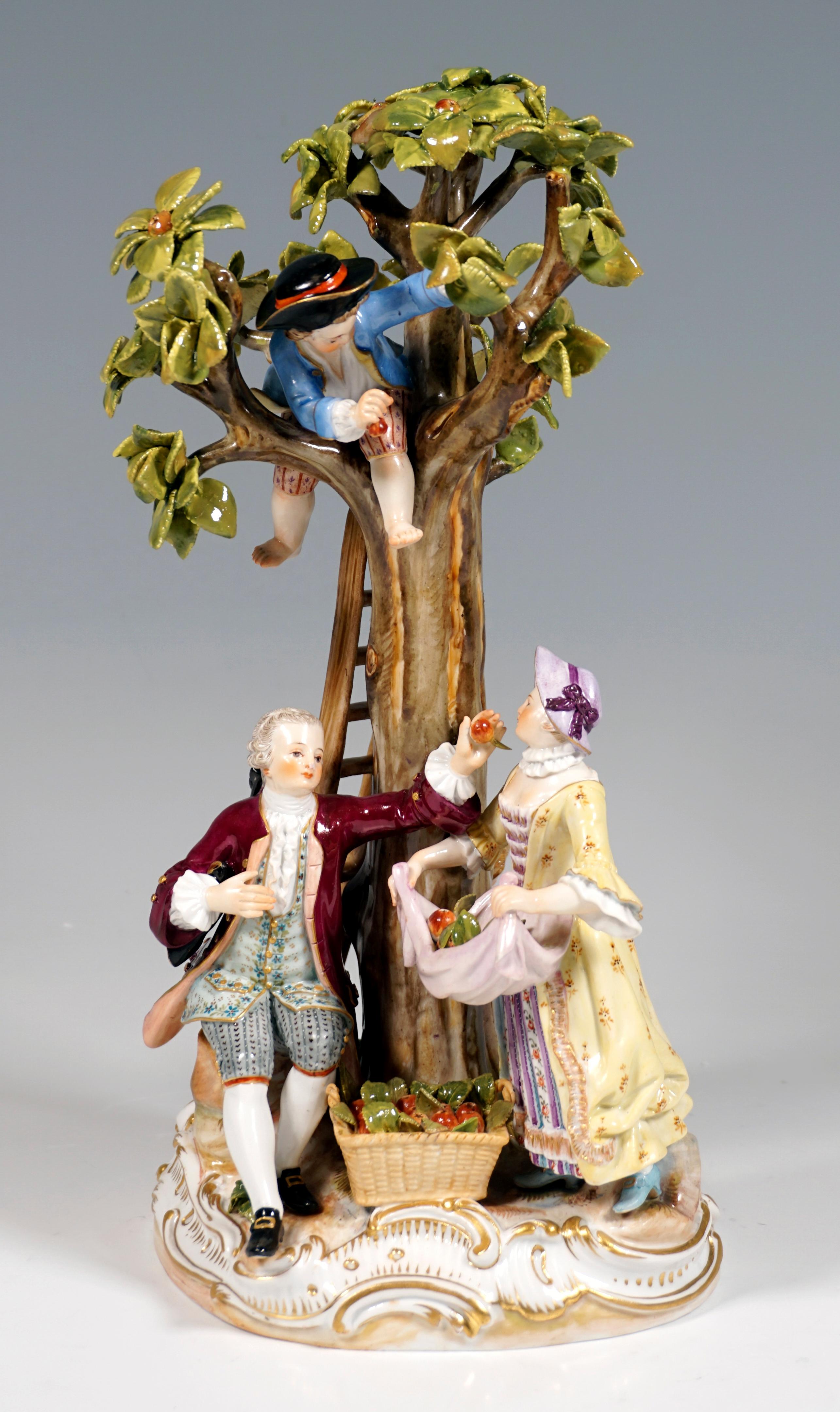 Elaborately crafted porcelain group from the 19th century:
A couple of gardeners and two boys harvesting apples, dressed in rural Rococo robes with fine decorations, a boy standing at the top end of the ladder leaning against the tree and picking