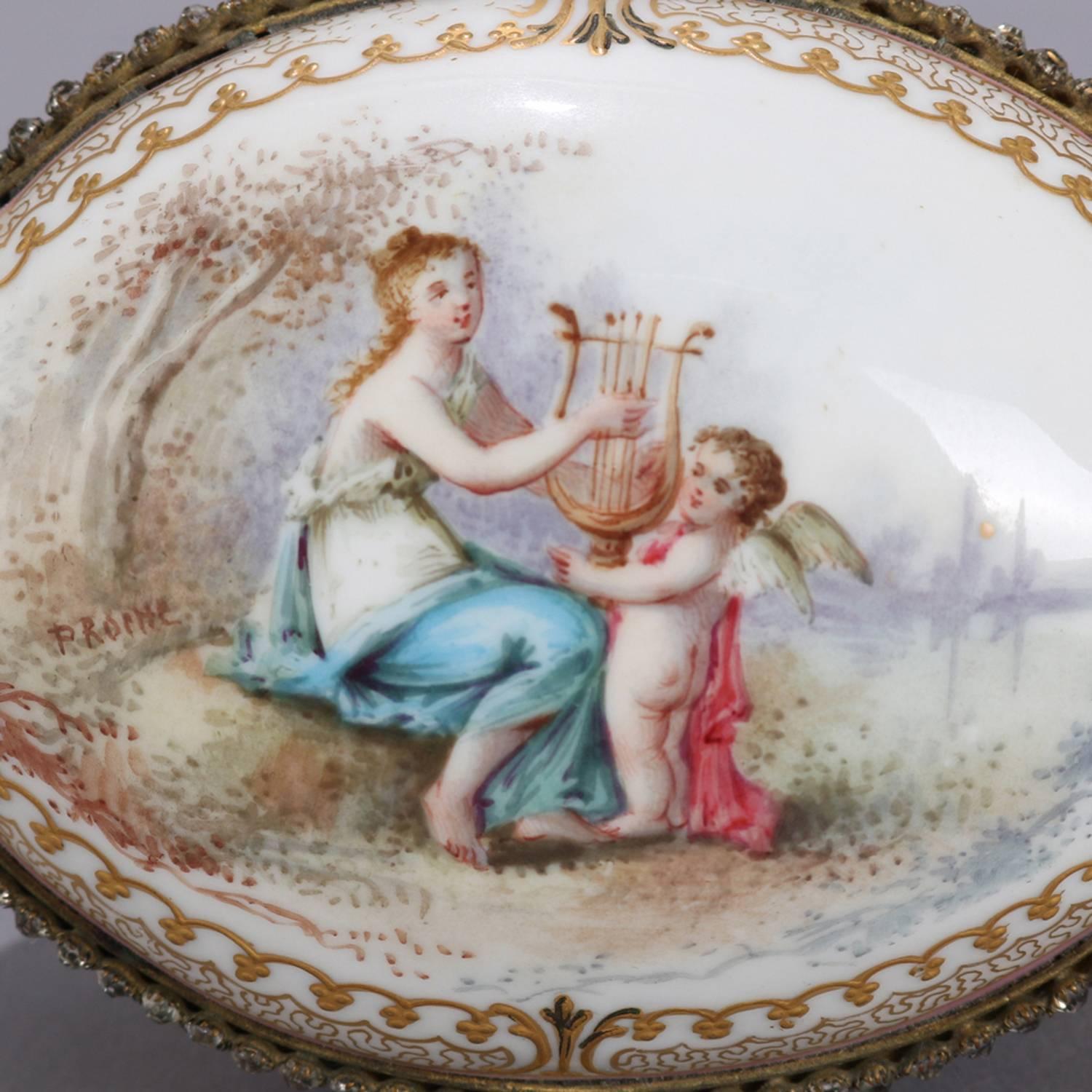 Meissen School hand-painted porcelain oval dresser box features egg form with central Classical scene with all-over floral and gilt decoration and bronze mounts, interior with floral reserves, signed P ROCHE, marked on base, 20th