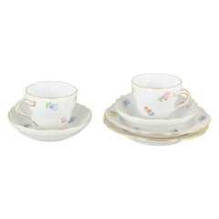 Meissen. Set of two porcelain mocha cups with saucers and plates. Mid-20th C.