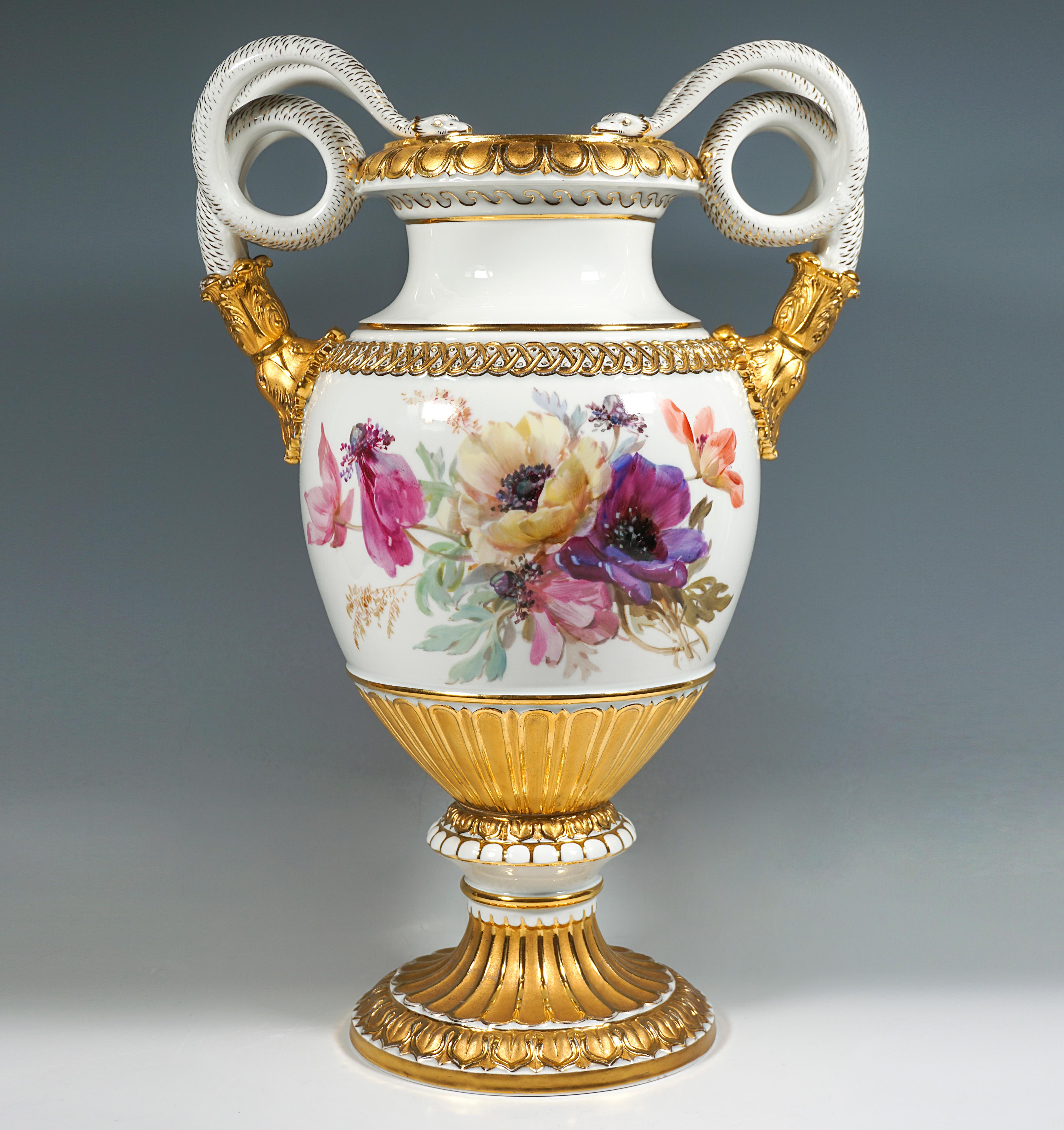 Very large double snake-handled vase in baluster form on a mounted funnel-shaped base, the handles raised at the sides in the form of coiled pairs of snakes, white ground, the front and back finely painted in soft polychrome with pink rhododendron