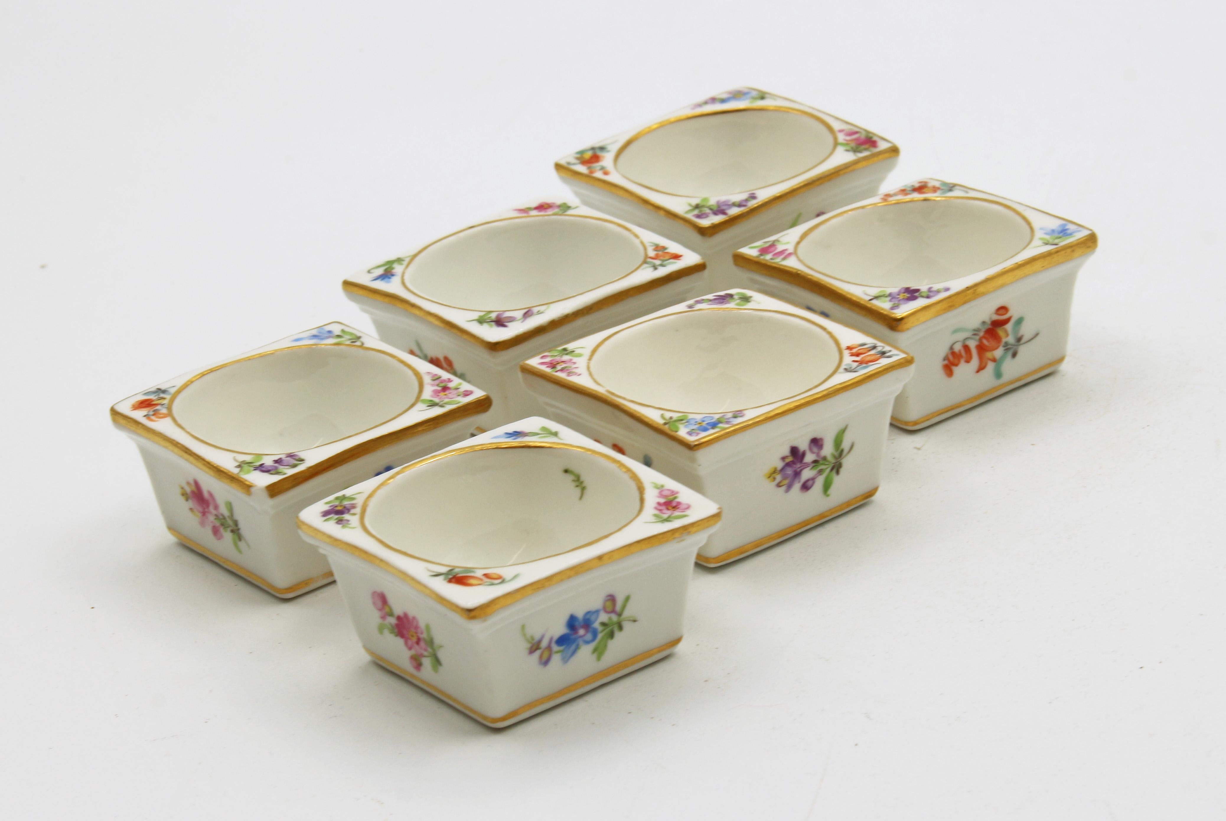 An assembled set of six square individual salt dips by Meissen. Florets and sprays on sides and corners. Hand painted. Mold #93, impressed, 1860-1924 marks. Slight size differences and decorator's marks. 1 9/16