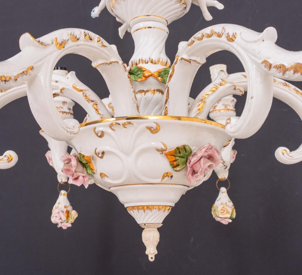 Meissen style porcelain six-light chandelier in the rococo taste, the central baluster issuing six candlearms with cherubs, decorated in white with polychrome and gilt decoration if flowers and figures. Measures: 20