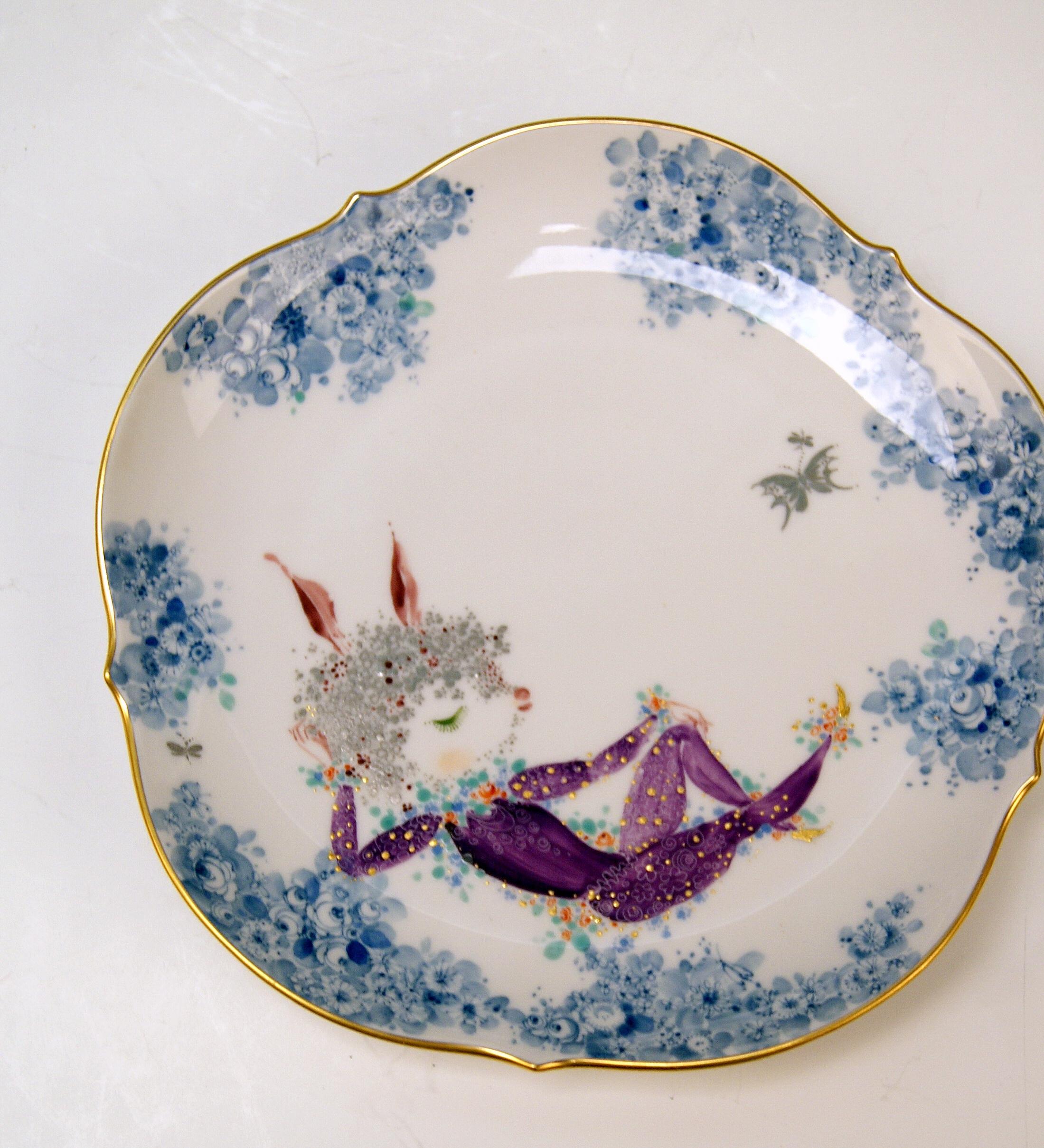 We invite you here to look at a SPLENDID as well as RARE Meissen tea set:
White porcelain, multicolored pattern consisting of flowers' blossoms and figurines  (DECOR SOMMERNACHTSTRAUM IN GERMAN = SUMMER NIGHT'S DREAM / DECOR NUMBER  680691).
Golden