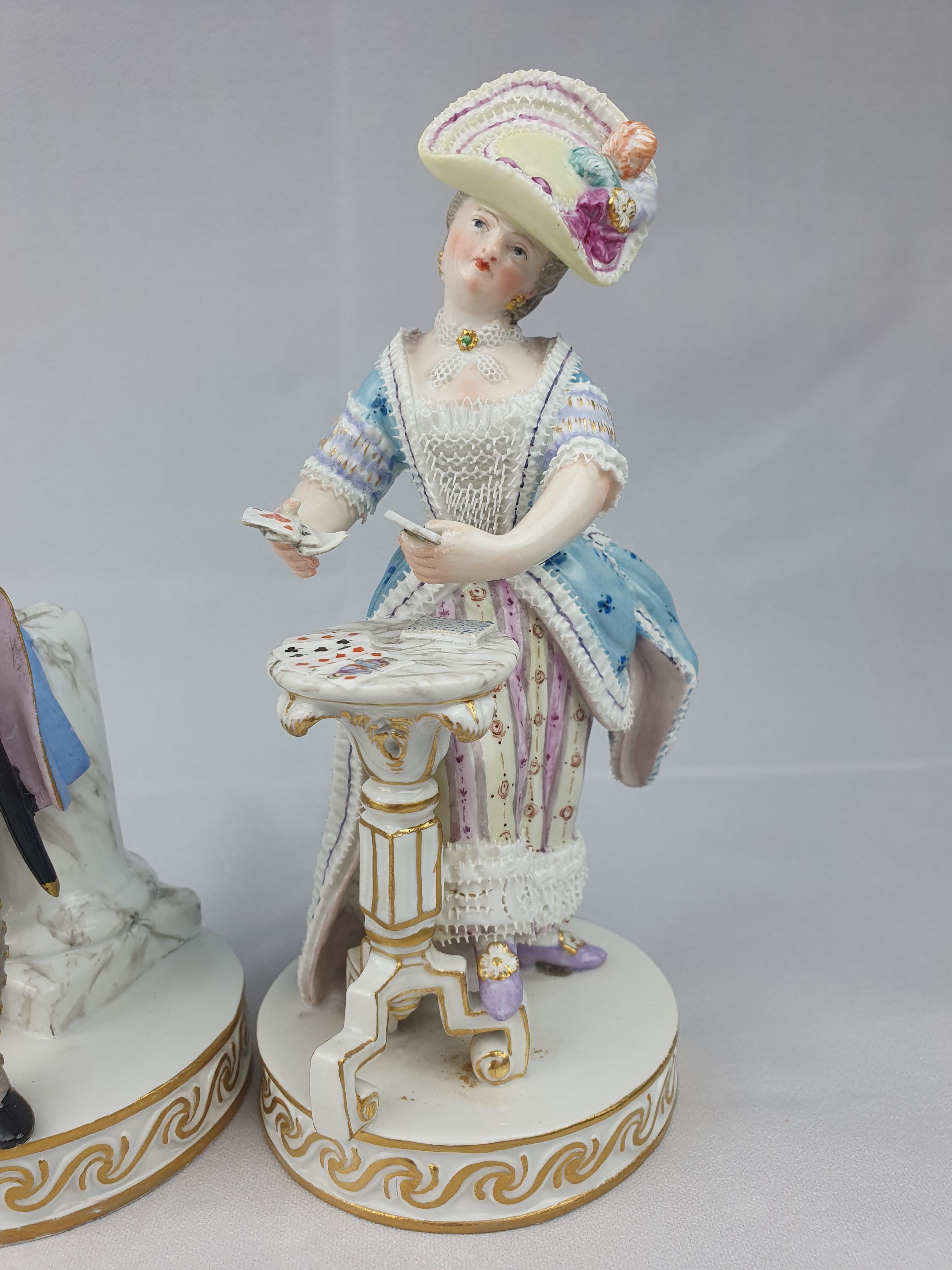 Meissen time and patience pair figures. Woman playing a game of patience and the man looking at his watch. First modelled by Acier with Schoenheit in 1776.

Model number f64 to both and Painters mark 48 to both.

Blue crossed swords. Circa 1870.