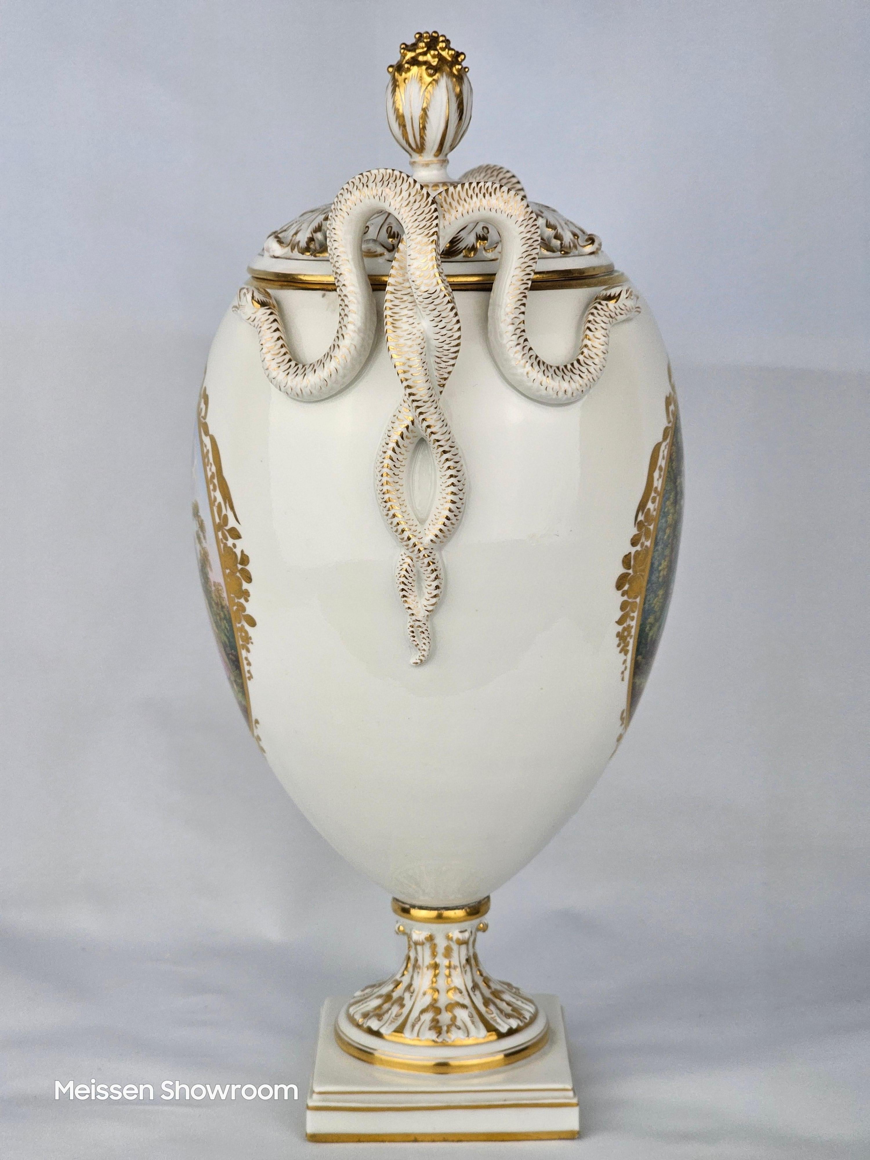 Meissen white and gold double snake handled vase with two scenes after Watteau. First modelled c.1780.
Height is 30cm