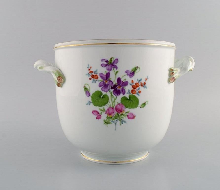 Meissen wine / champagne cooler in hand-painted porcelain with flowers and gold edge. 
Handles are modelled as branches. 
Early 20th century.
Measures: 26 x 18 cm.
In excellent condition.
Stamped.
1st factory quality.