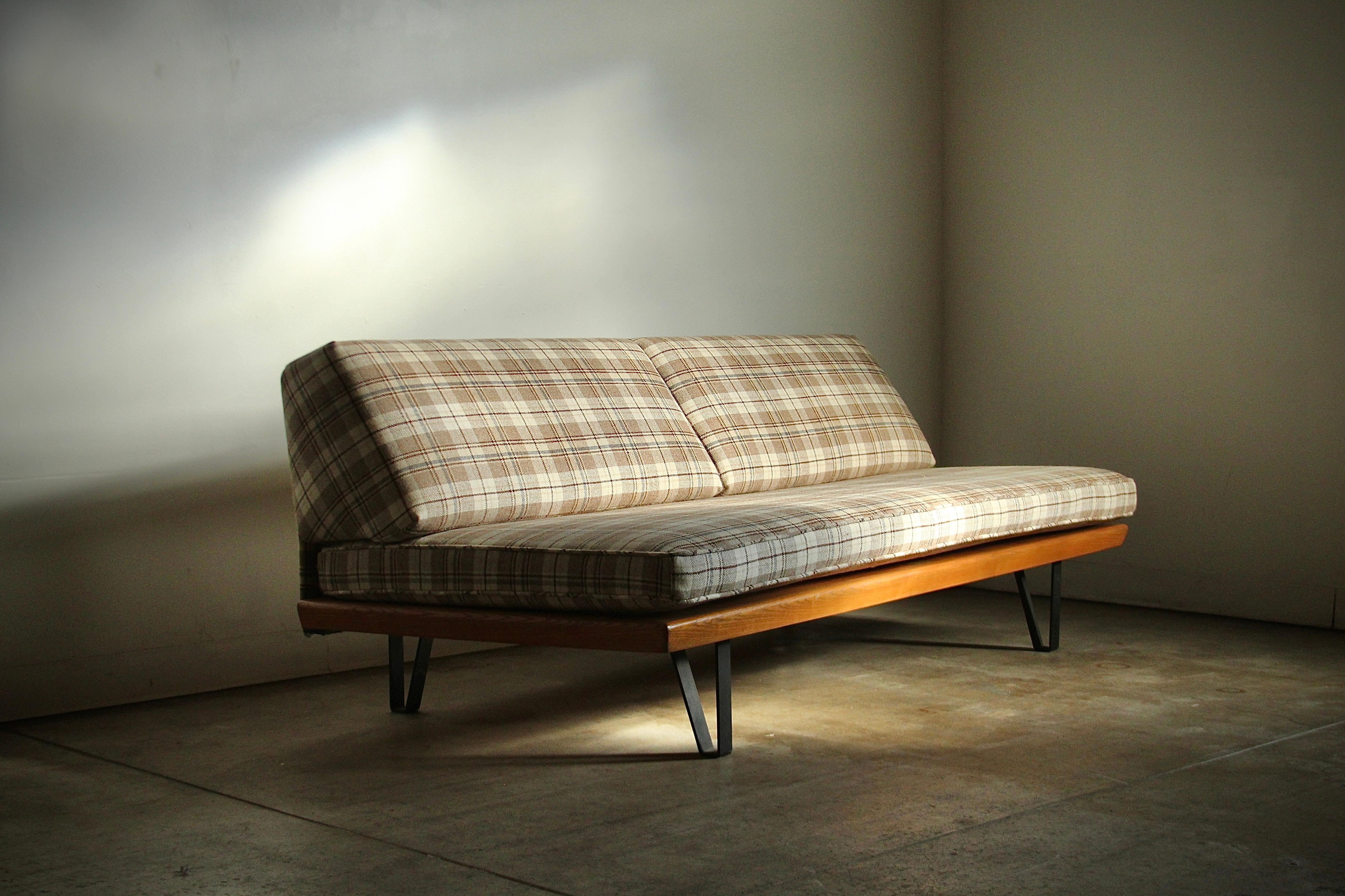 A lovely, California modernist sofa/daybed designed by Mel Bogart and manufactured by Felmore Associates in the 1950s. The sofa has been fully restored - the solid oak frame has been refinished, and the cushions have been beautifully recovered in a