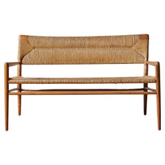 Banc Mel Smilow avec assise et dossier en jonc tissé