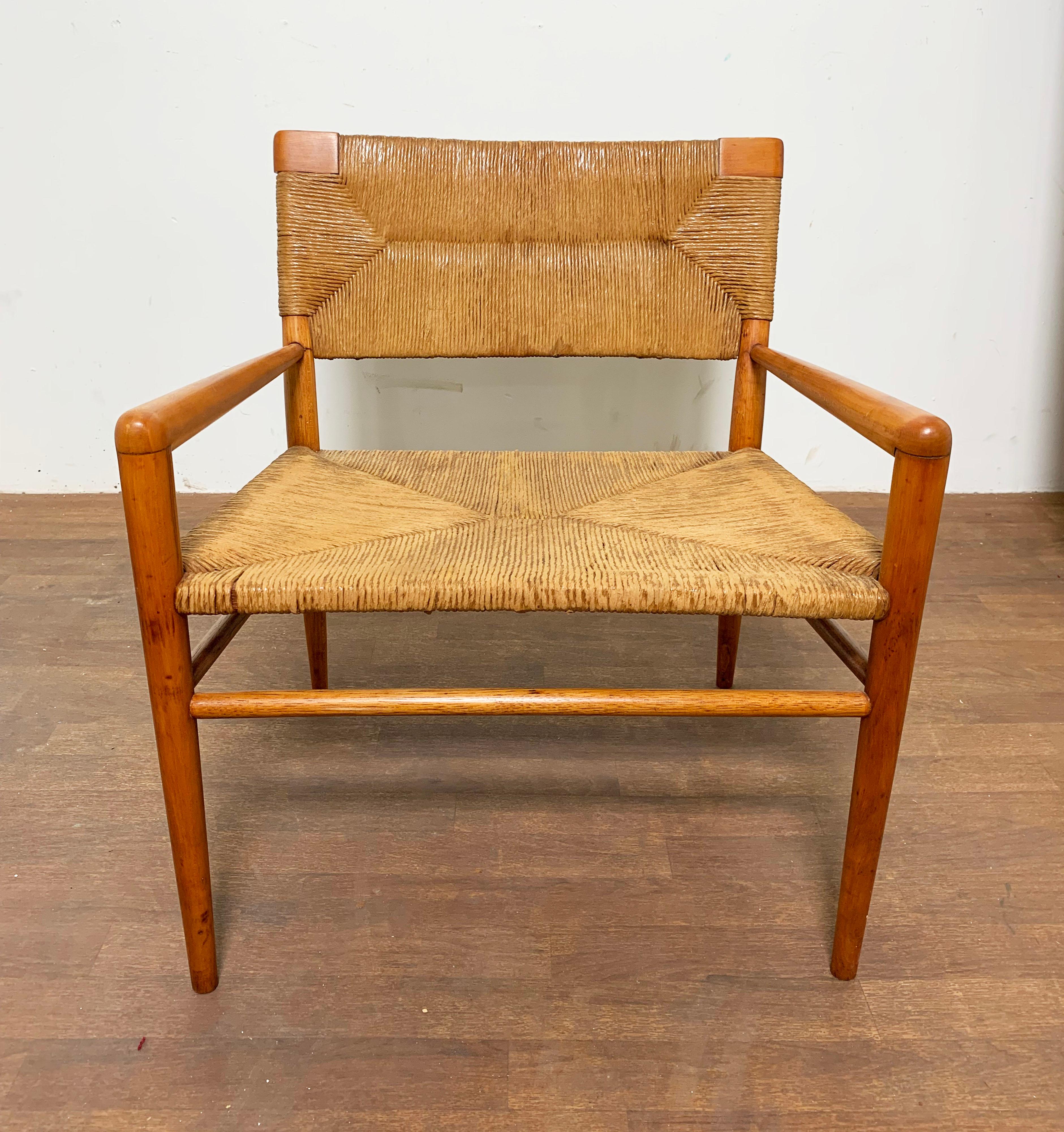 An original lounge chair in birch and rush designed and produced by Mel Smilow in the 1950s.