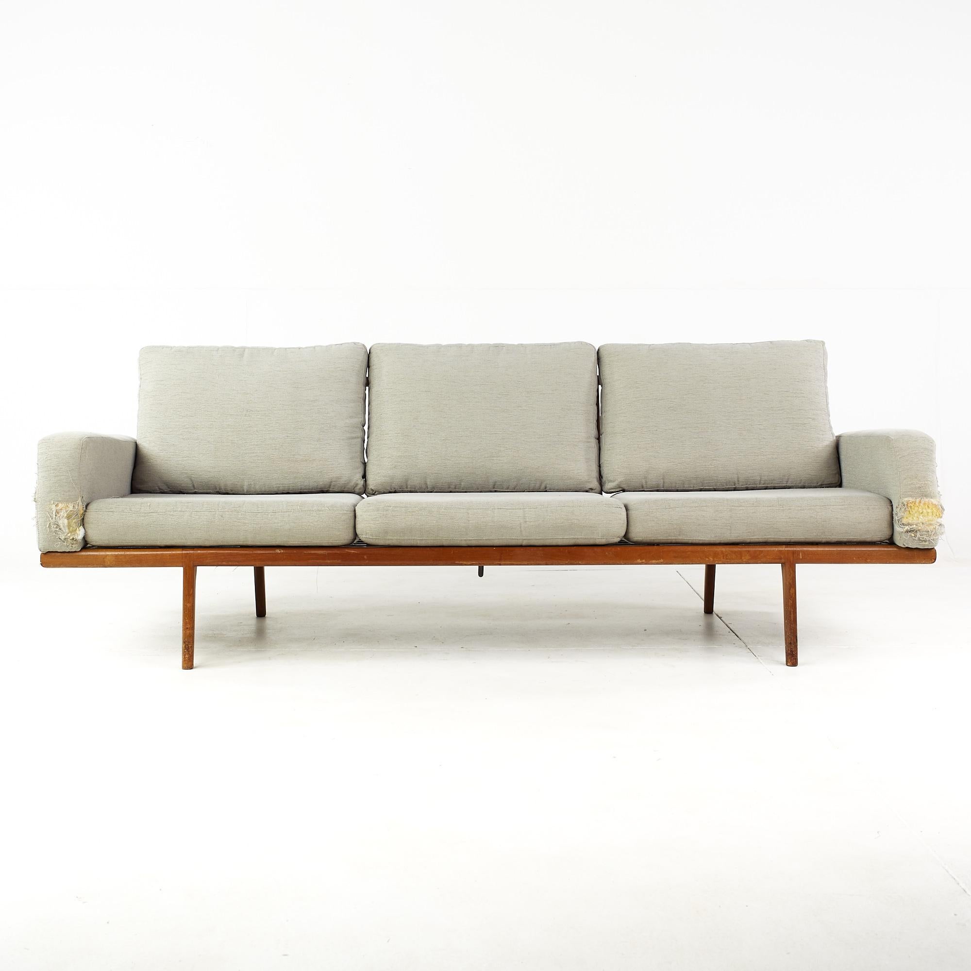Mel Smilow mid century walnut rail back sofa.

This sofa measures: 83 wide x 31 deep x 29 inches high, with a seat height of 15 and arm height of 21 inches.

Ready for new upholstery. This service is available for an additional fee.

All