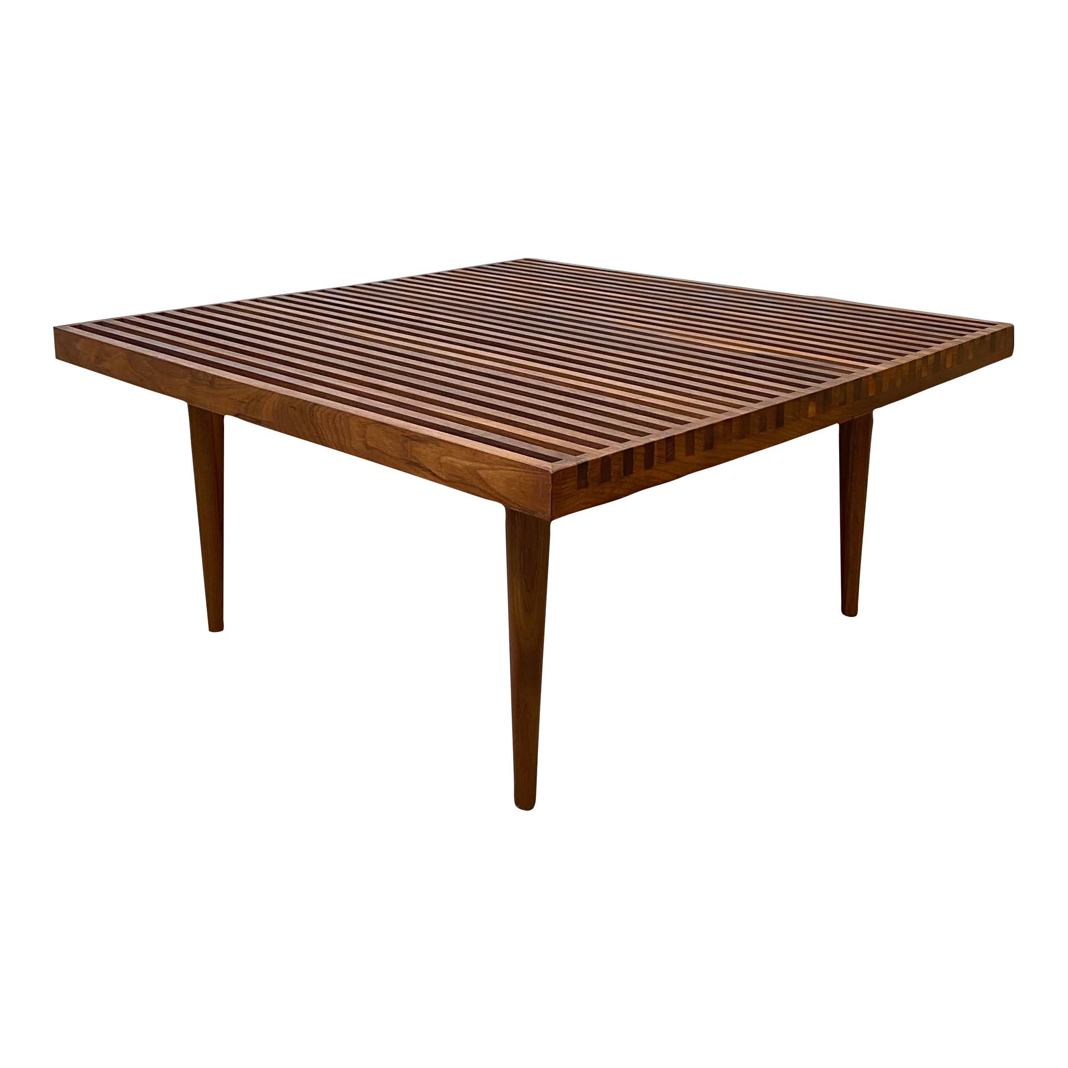 Mid-Century Modern slat coffee or side table by Mel Smilow.
Listing is for each table, two available sold separately.
Walnut dovetailed slated table design.
Tables could be used individually as a single or double coffee table or side table set up.