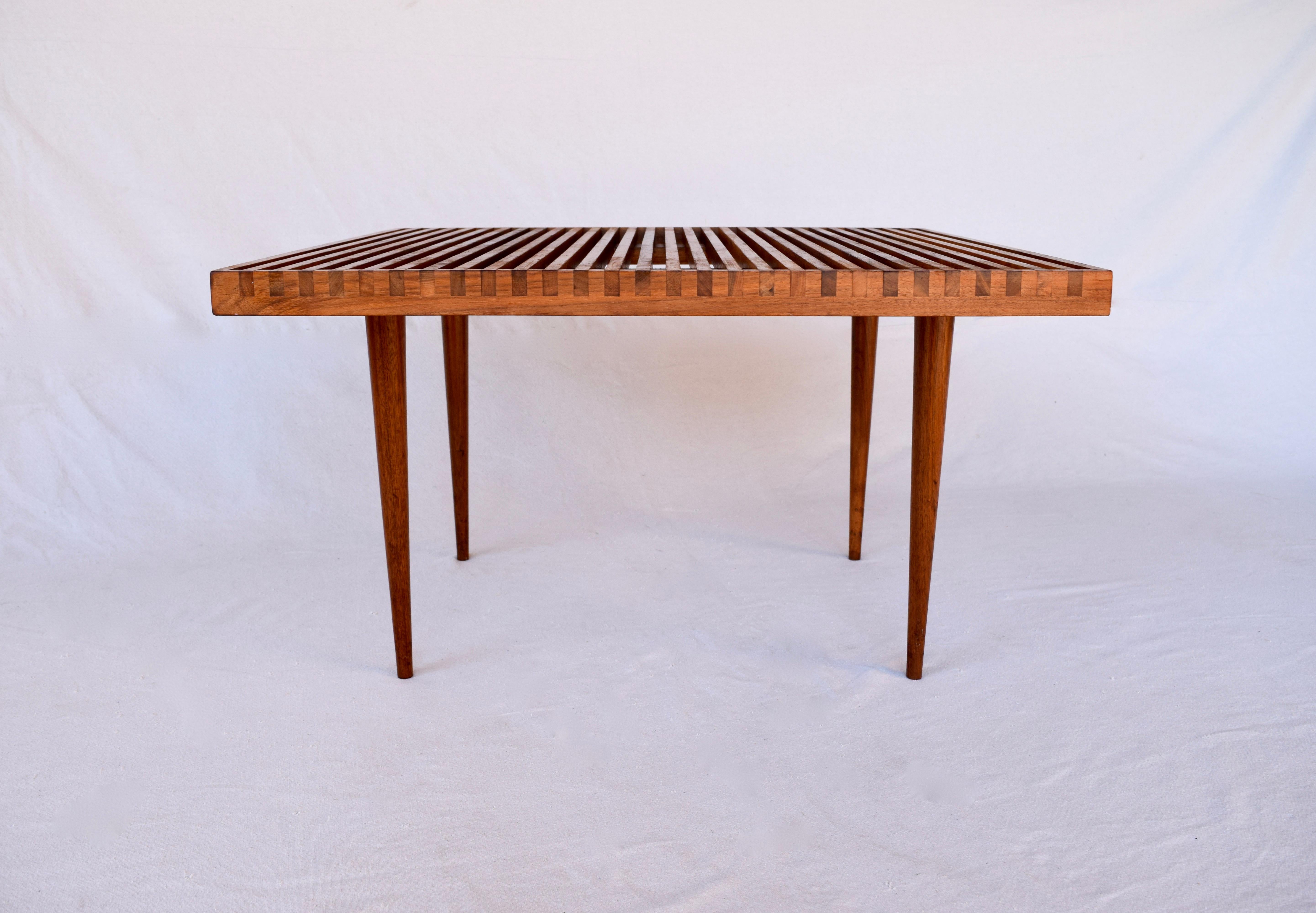 Walnut dovetailed slatted coffee table designed by Mel Smilow for Smilow-Thiele.
Unusual multifunctional square format and dimensions.