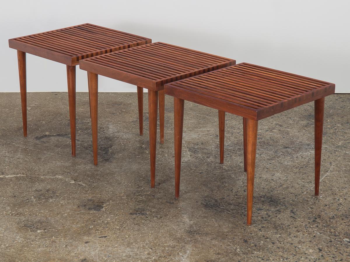 Set of three walnut slatted side tables, designed by Mel Smilow for Smilow-Thiele. A hard-to-find size that is especially functional, whether used as side tables or configured into a coffee table. This classic design is exceptionally crafted, with a