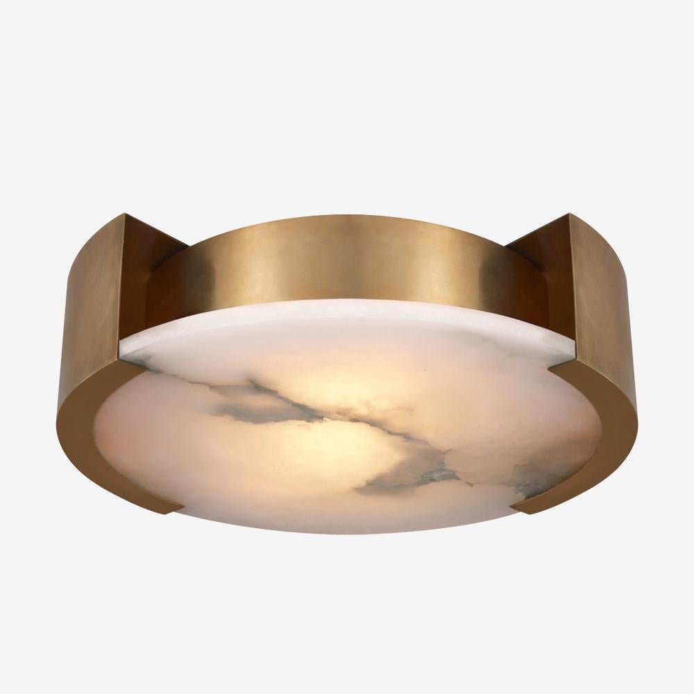 Effortlessly pairing natural alabaster and sleek metal detailing in a streamlined geometric form, the Melange large flush mount exudes a modern refinement while emphasizing the beauty of natural stone. This fixture features hand-carved natural