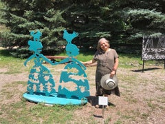 Making New Friends, teal aluminum sculpture Korean & Navajo Women outdoor heart