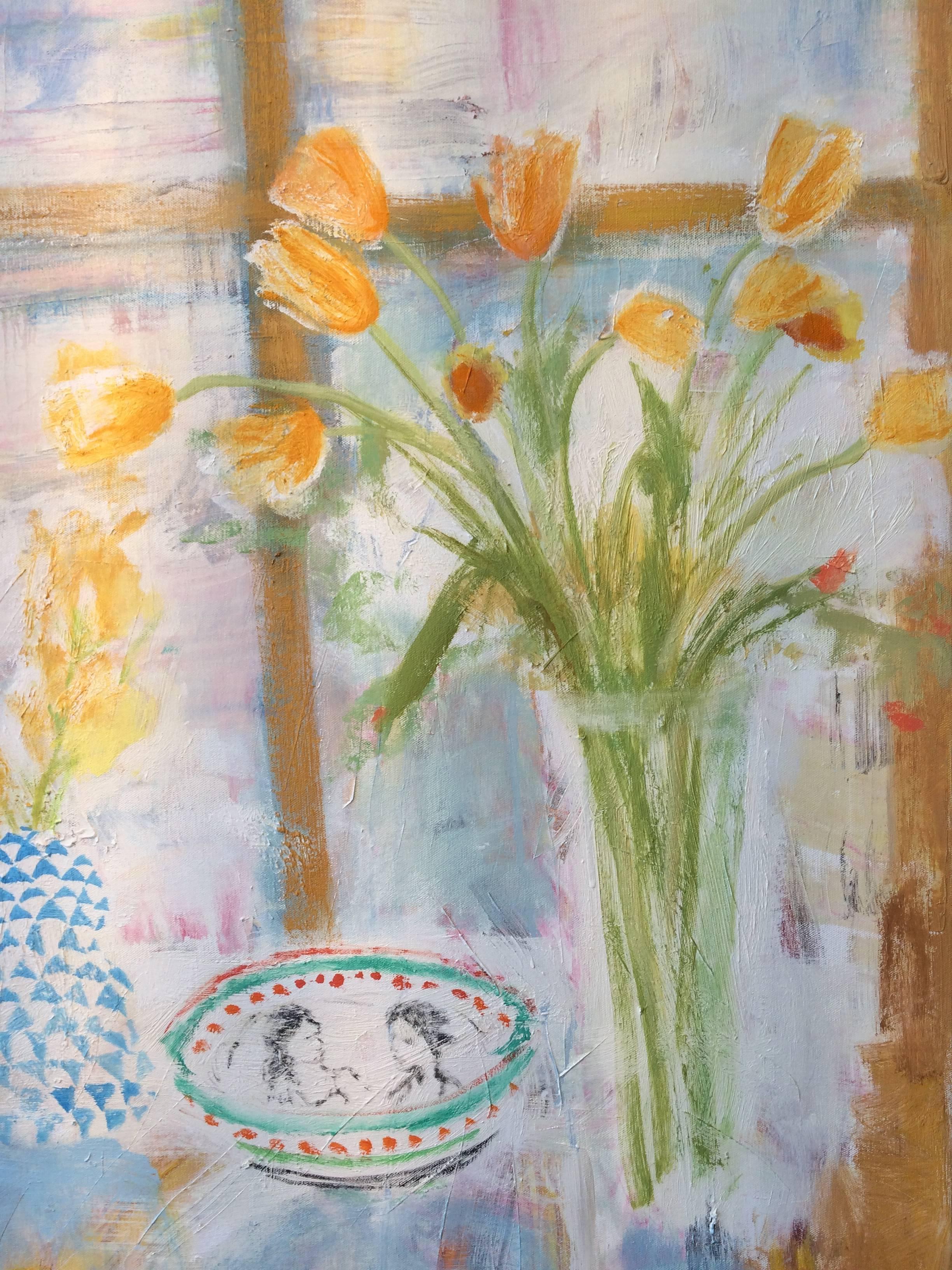 Contemporary painting in oil on canvas of a bright and inviting interior scene with a botanical still life arrangement of two vases with yellow daffodils and orange tulips, a pair of yellow teacups beside a blue, yellow and white plate, and various